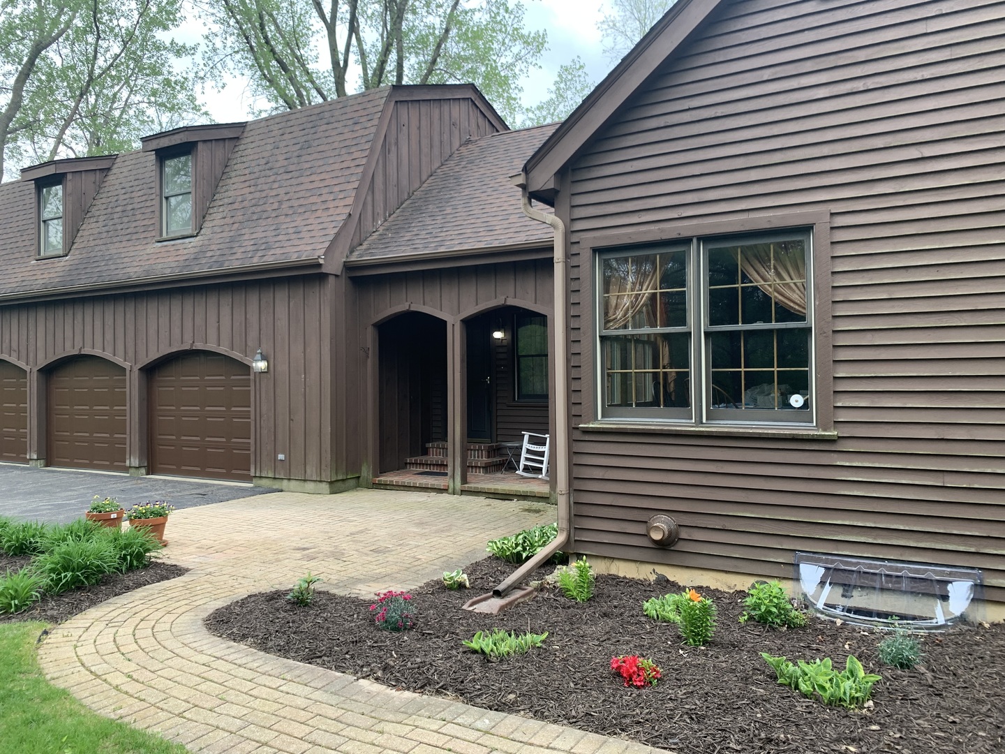 3816 Deep Cut Road Woodstock, IL 60098 - Photo 21 of 32 a front view of a house with a yard and garage