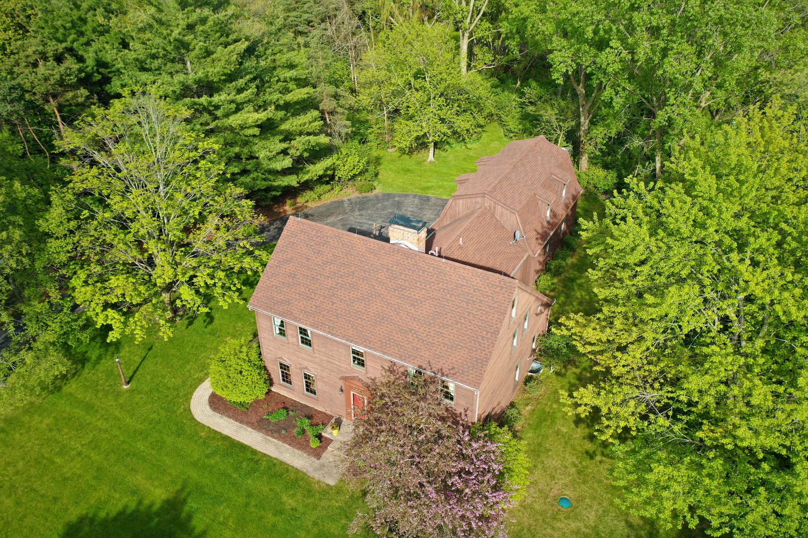 3816 Deep Cut Road Woodstock, IL 60098 - Photo 28 of 32 an aerial view of a house with a yard and trees