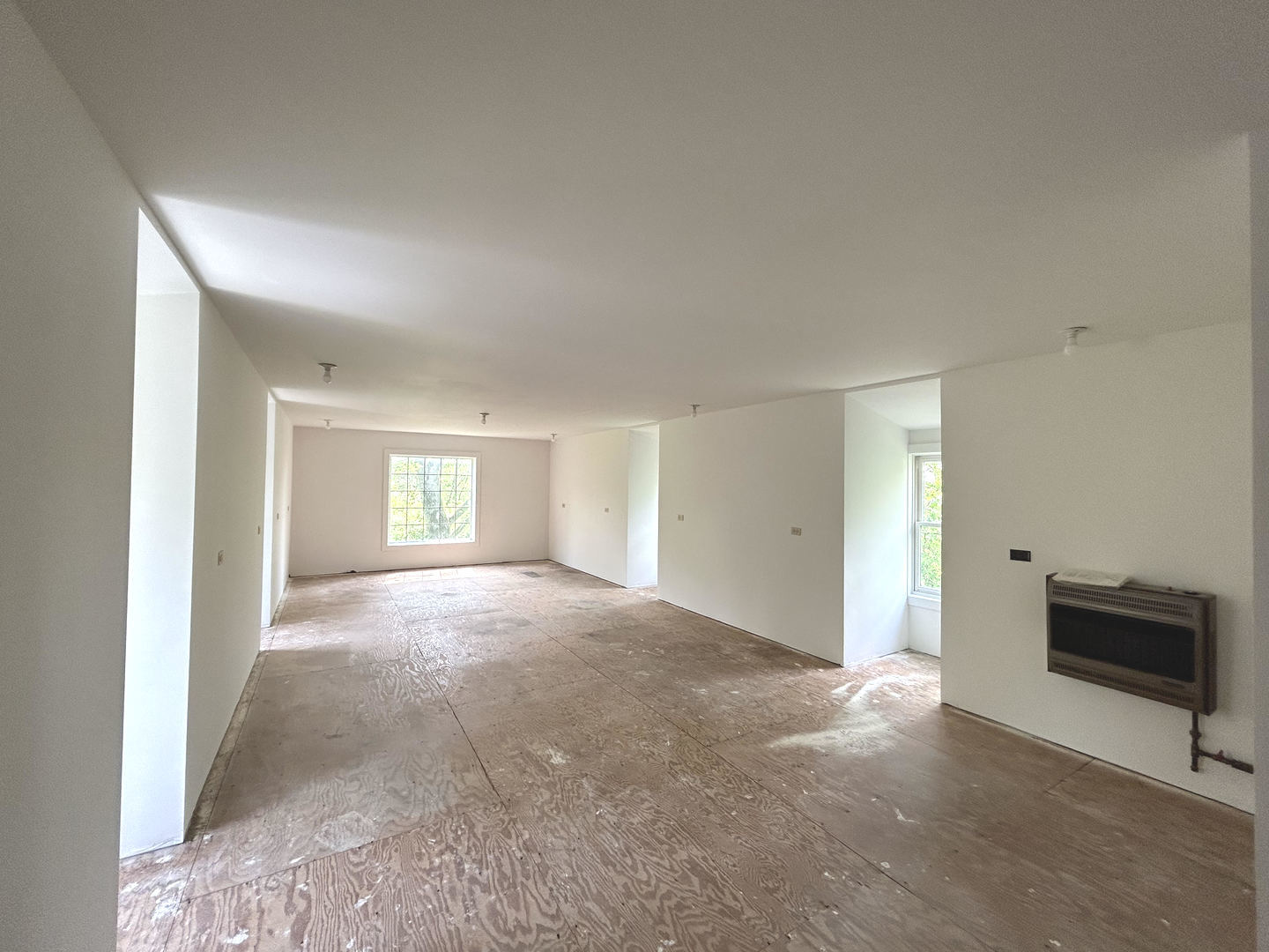 3816 Deep Cut Road Woodstock, IL 60098 - Photo 31 of 32 a view of a big room with windows and cabinet