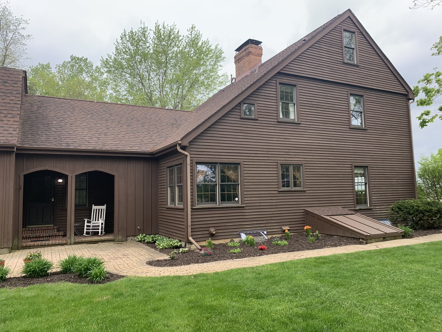 3816 Deep Cut Road Woodstock, IL 60098 - Photo 4 of 32 a front view of a house with garden