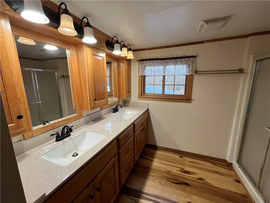 83 Seger Road Punxsutawney, PA 15767 - Photo 19 of 24 a spacious bathroom with a double vanity sink and a mirror