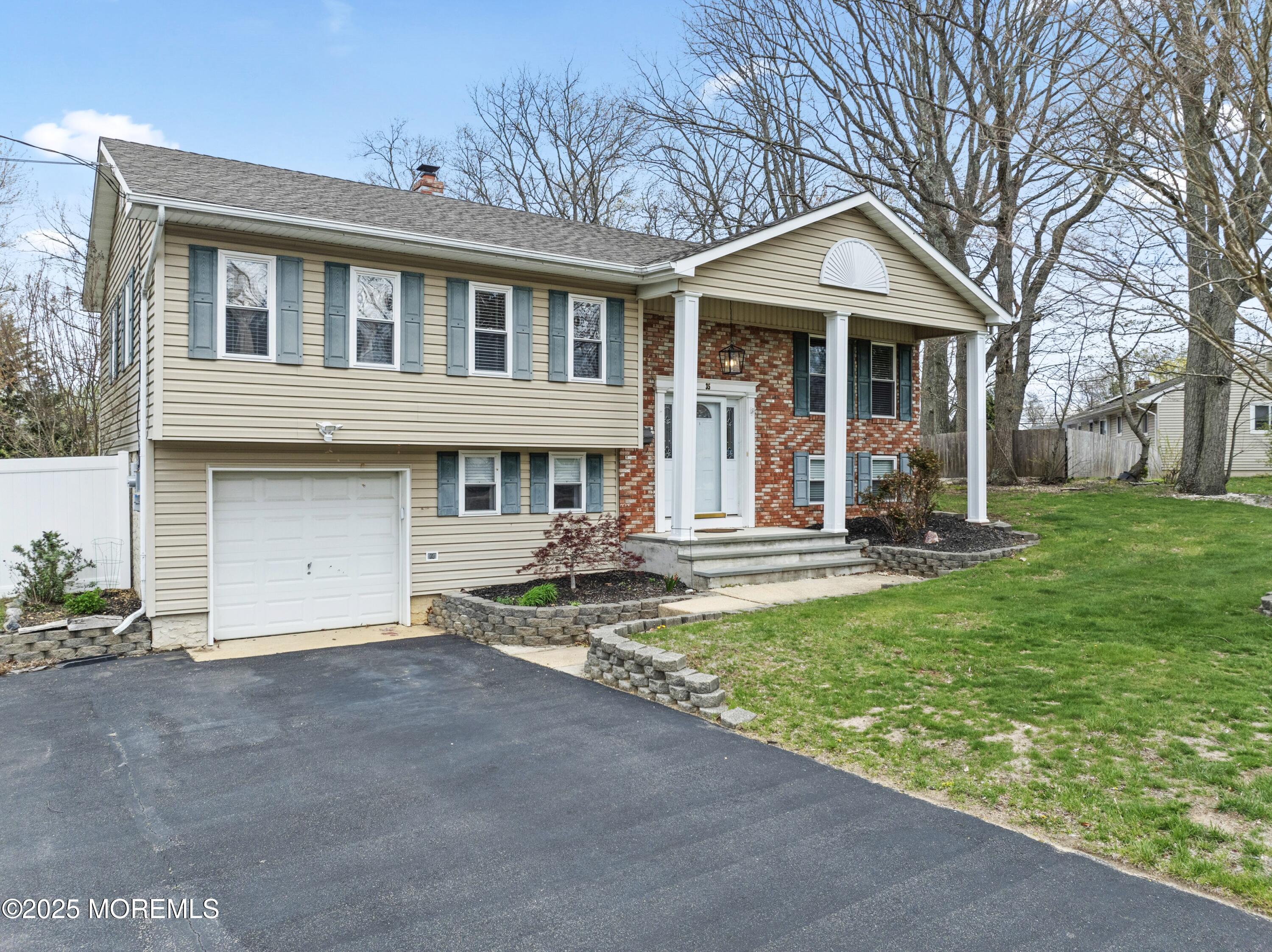 35 Chestnut Hill Road Howell, NJ 07731 - Photo 1 of 30 front view of a house with a yard