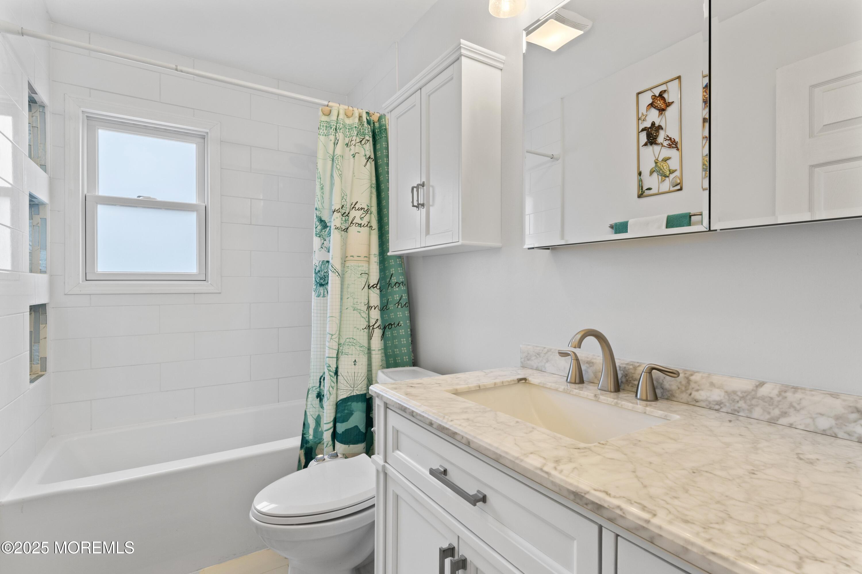 35 Chestnut Hill Road Howell, NJ 07731 - Photo 15 of 30 a bathroom with a granite countertop sink a toilet and a bathtub