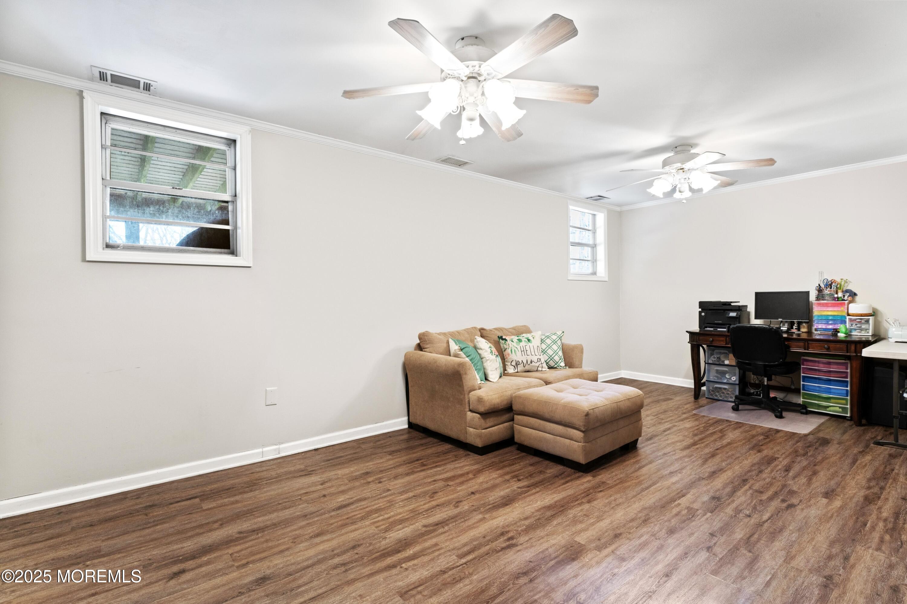 35 Chestnut Hill Road Howell, NJ 07731 - Photo 17 of 30 a living room with furniture and a wooden floor