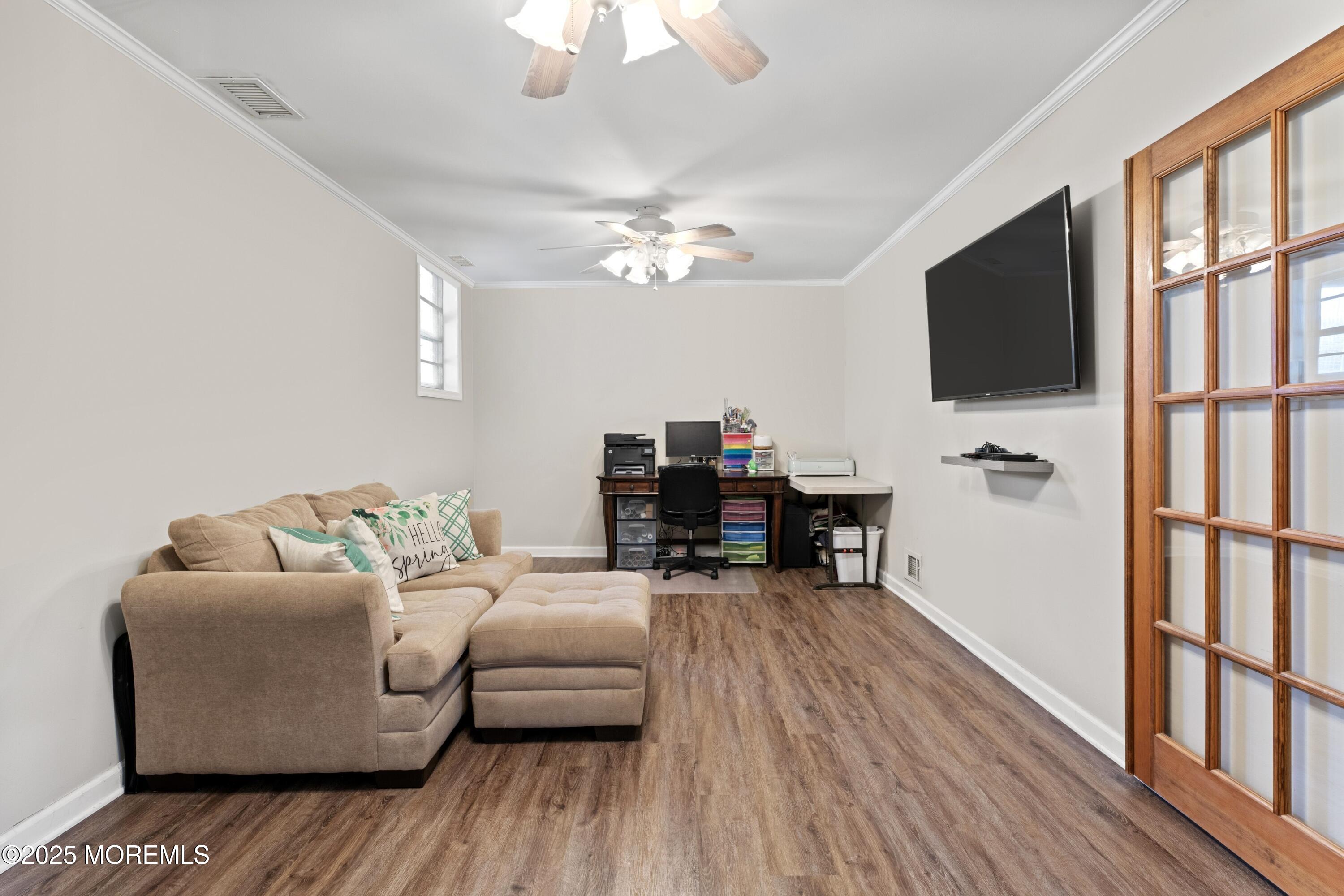 35 Chestnut Hill Road Howell, NJ 07731 - Photo 18 of 30 a living room with furniture and a flat screen tv