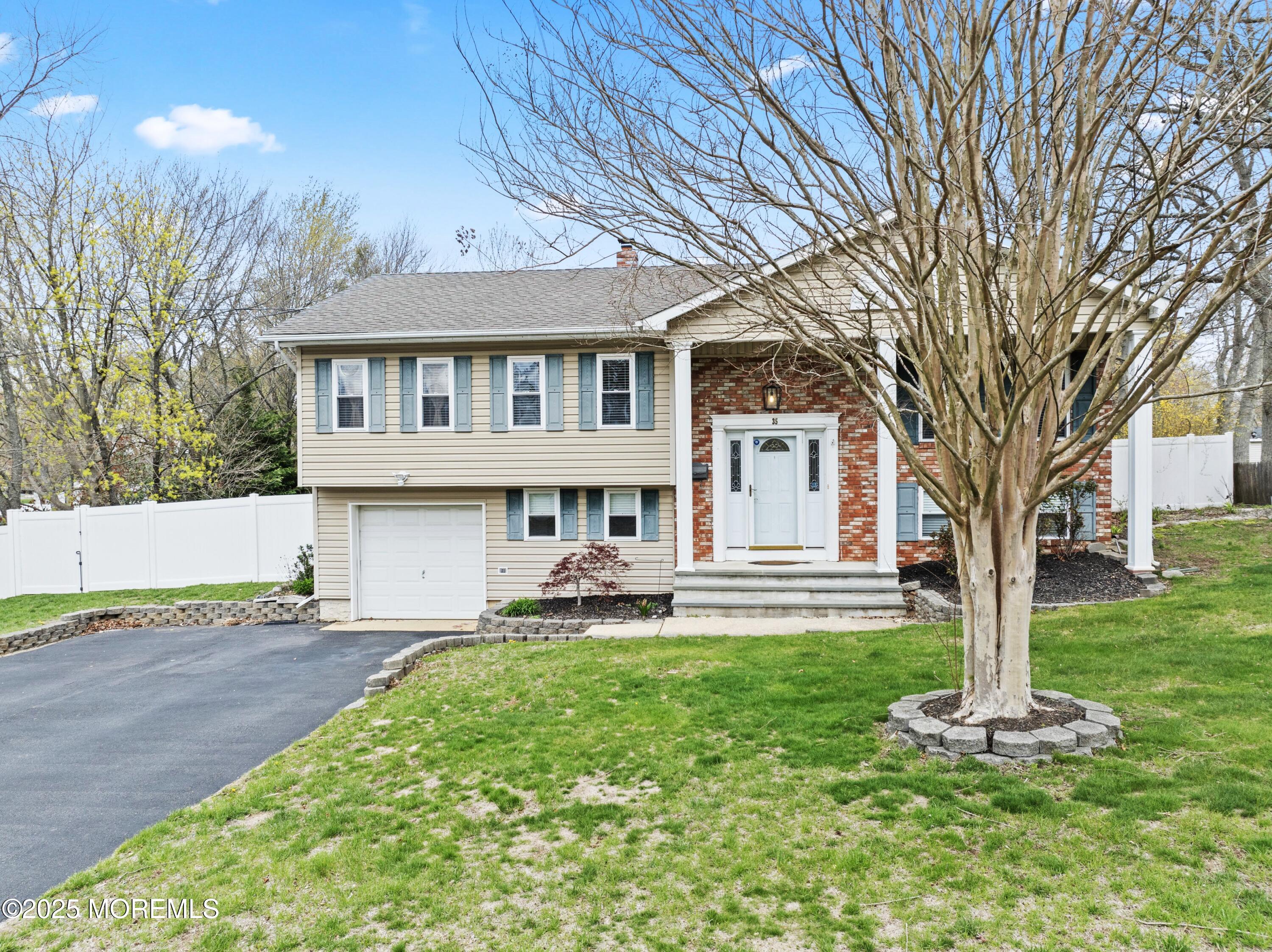 35 Chestnut Hill Road Howell, NJ 07731 - Photo 2 of 30 a front view of a house with a yard and trees