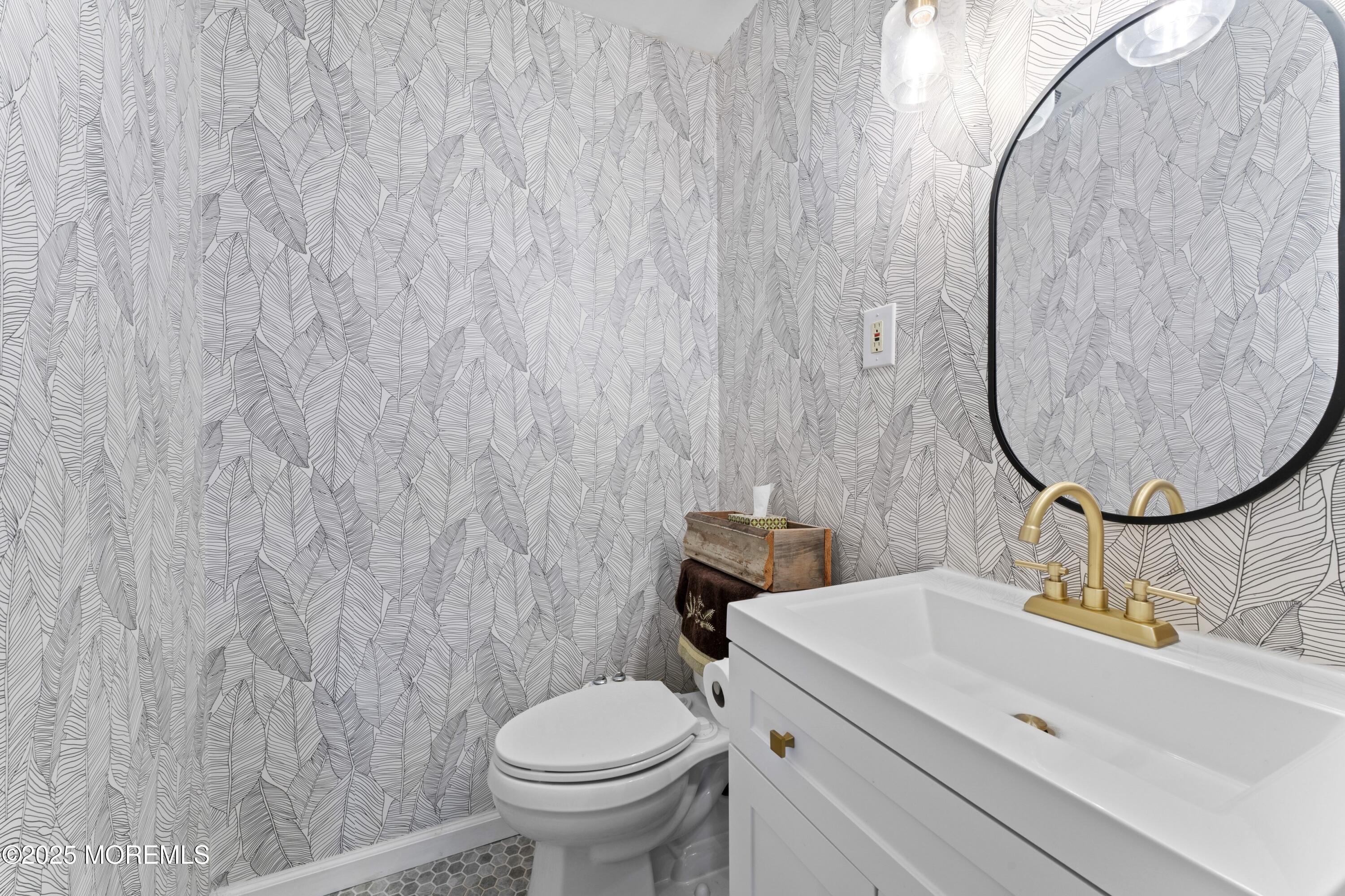 35 Chestnut Hill Road Howell, NJ 07731 - Photo 19 of 30 a bathroom with a sink and a mirror