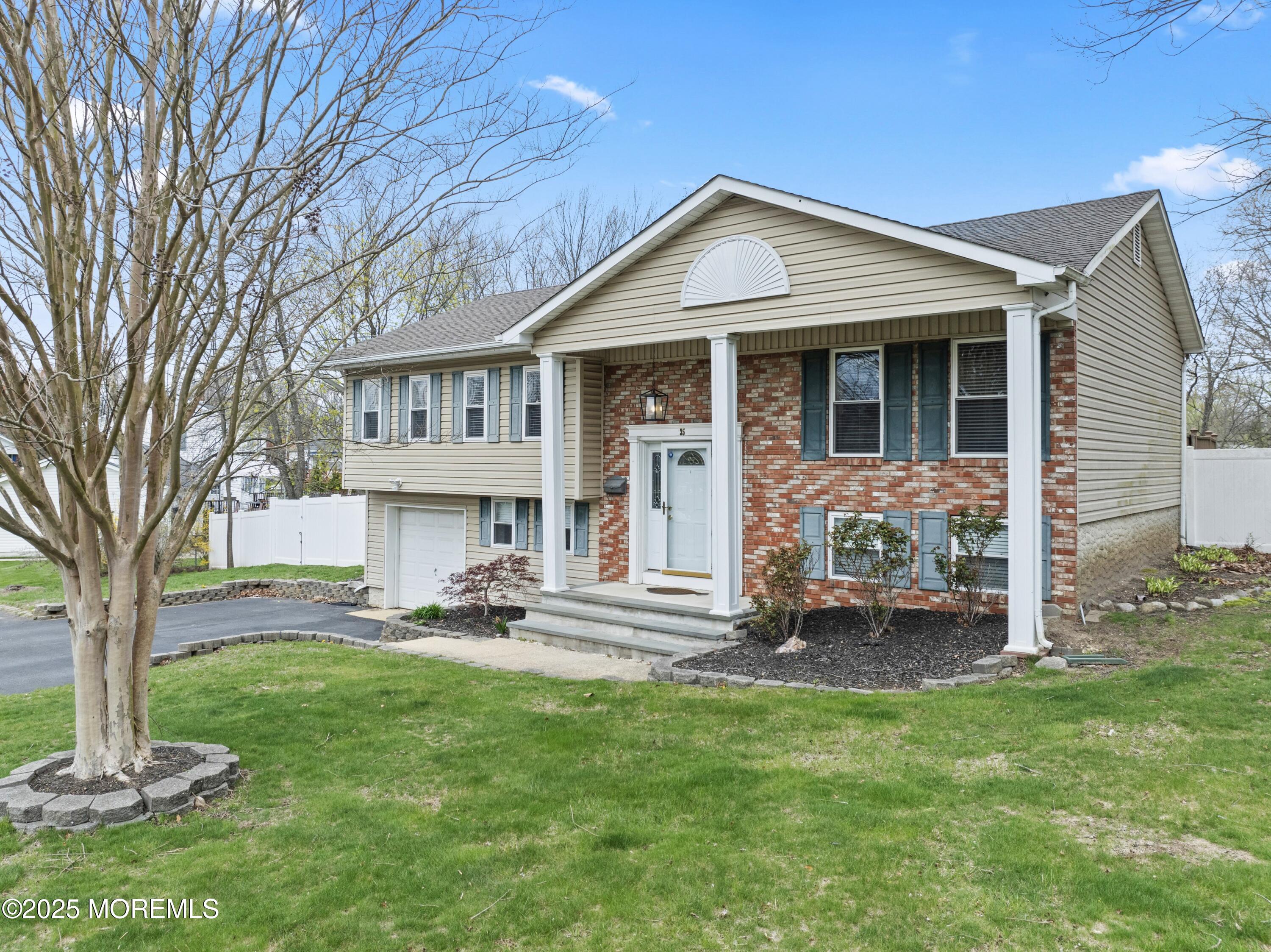 35 Chestnut Hill Road Howell, NJ 07731 - Photo 3 of 30 a front view of a house with a yard