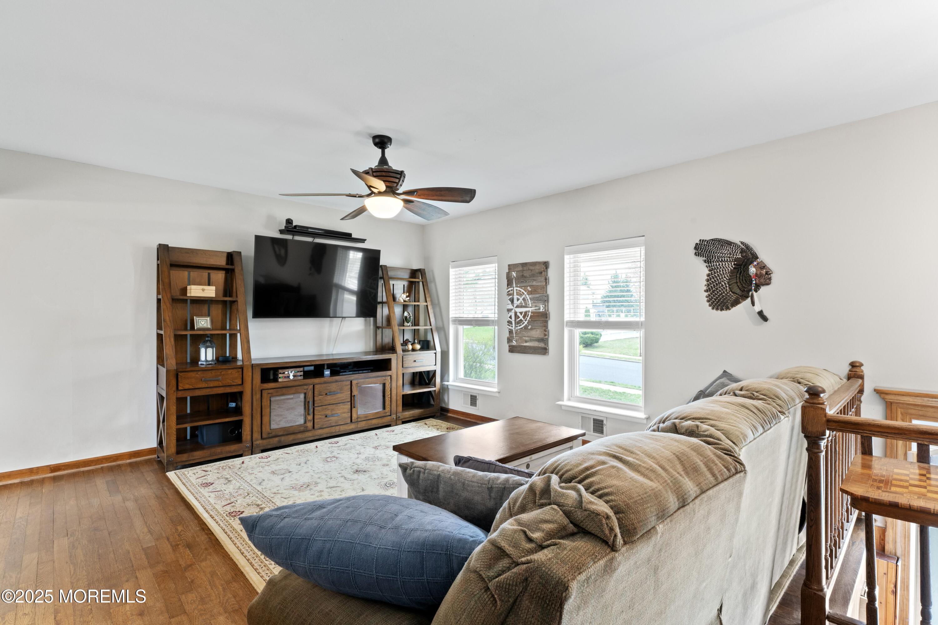 35 Chestnut Hill Road Howell, NJ 07731 - Photo 4 of 30 a living room with furniture and a flat screen tv