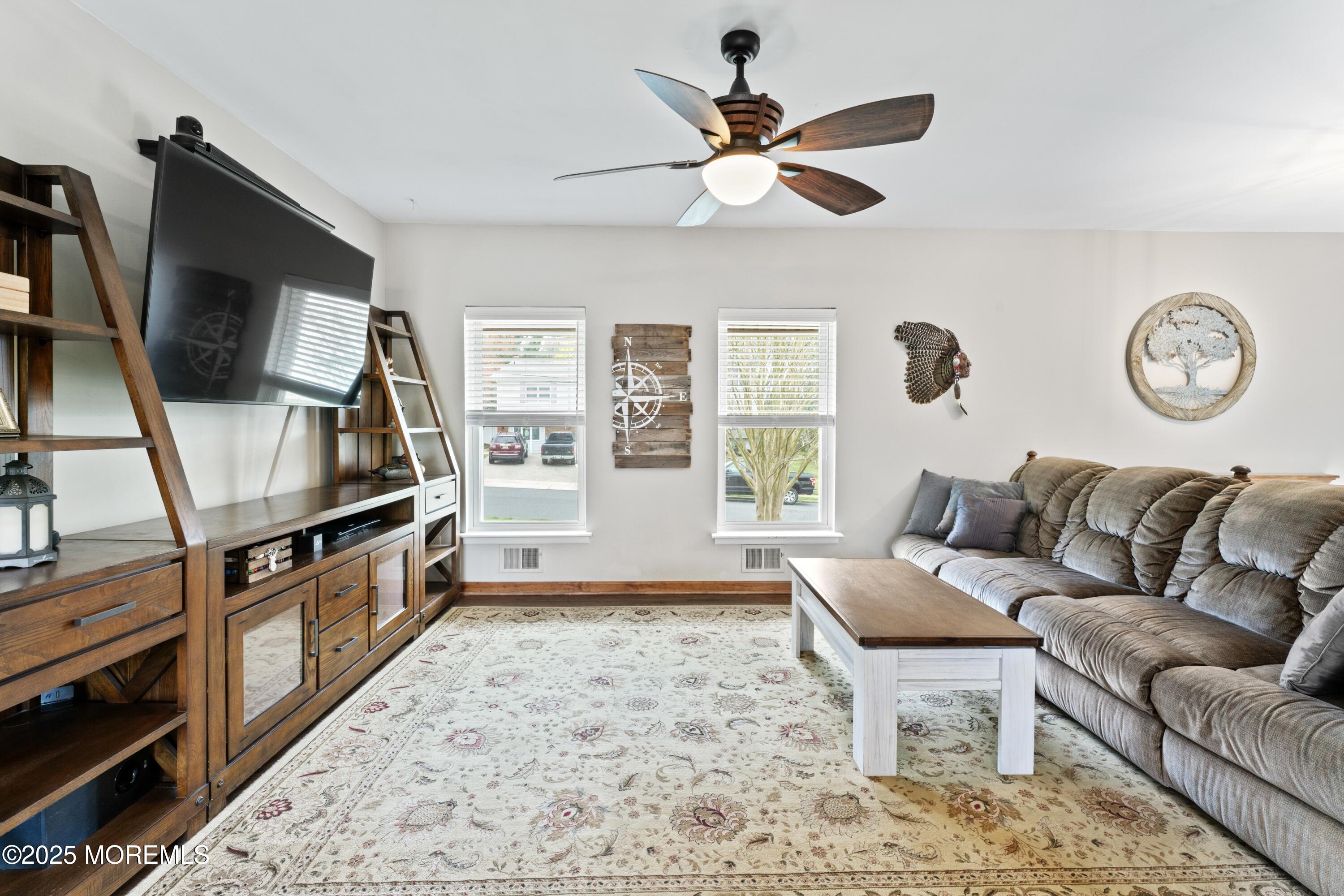 35 Chestnut Hill Road Howell, NJ 07731 - Photo 5 of 30 a living room with furniture and a flat screen tv