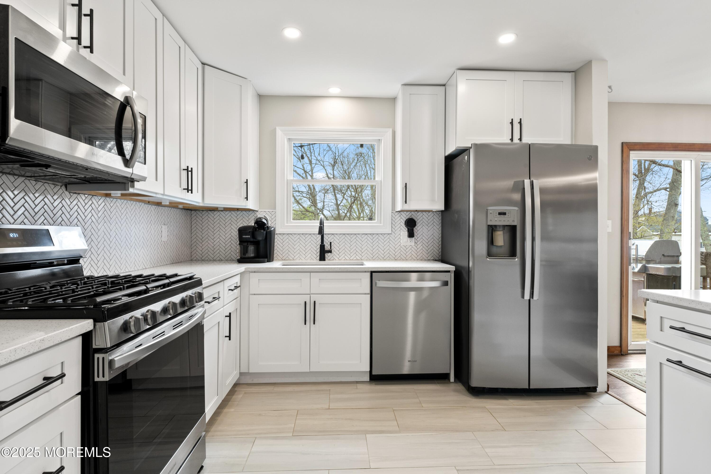 35 Chestnut Hill Road Howell, NJ 07731 - Photo 7 of 30 a kitchen with a refrigerator stove and microwave