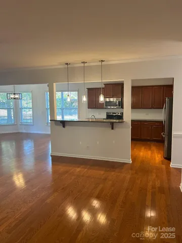 a view of a kitchen and dining room