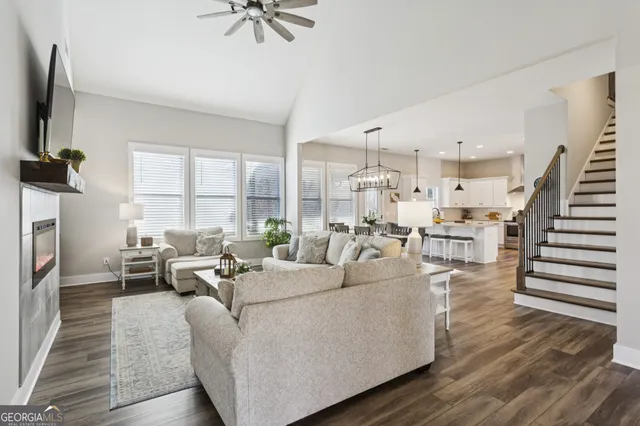 a living room with furniture and a flat screen tv