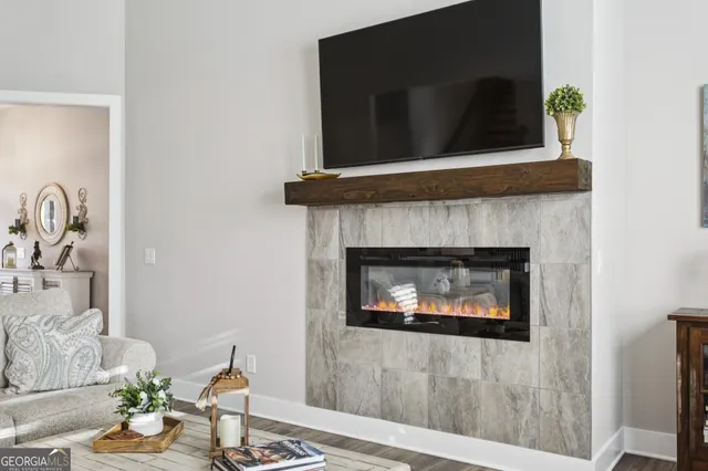 a living room with furniture and a fireplace