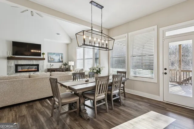 a view of a dining room with furniture window and wooden floor