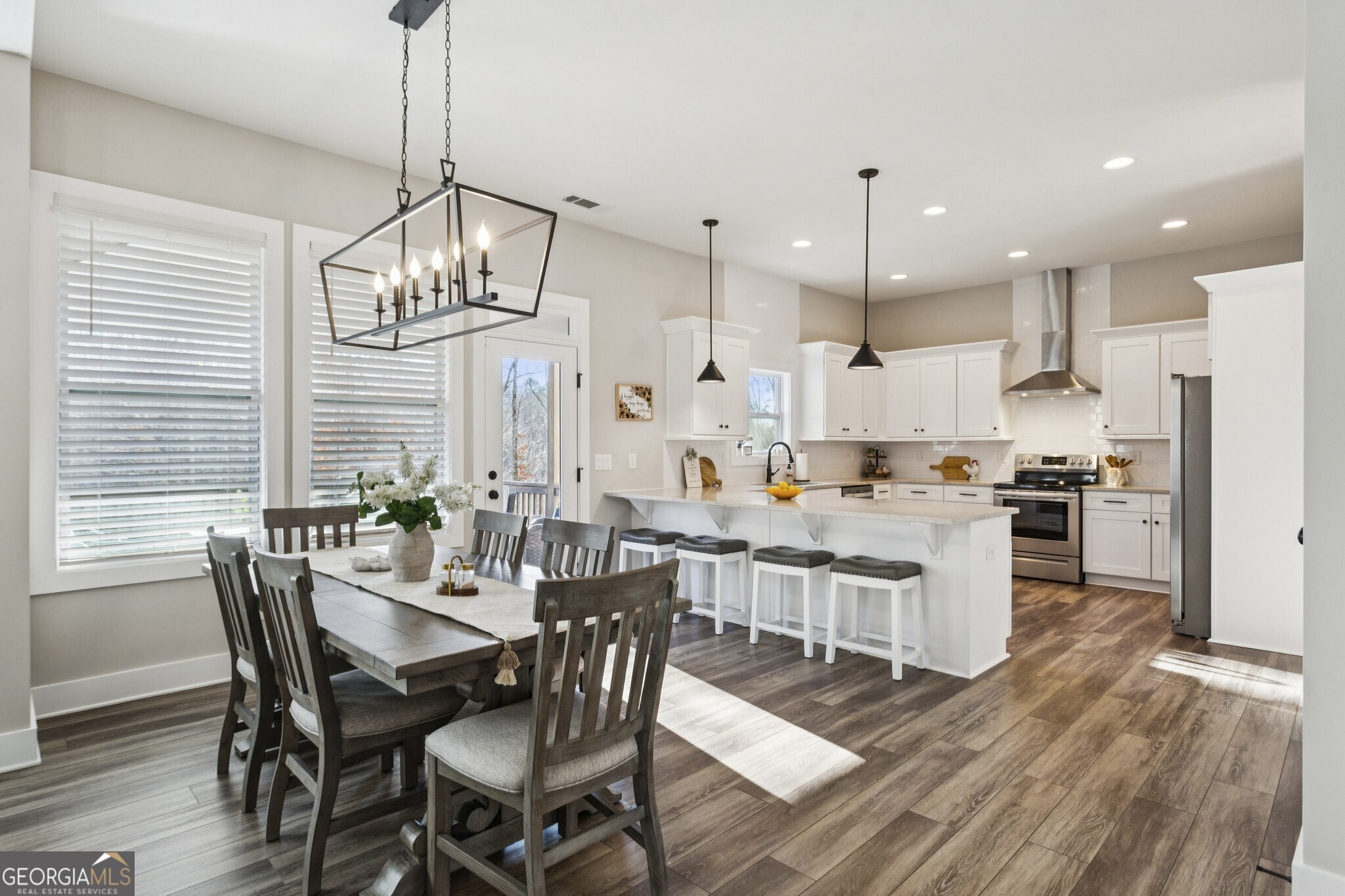 20 Bluestone Way Northeast Cartersville, GA 30121 - Photo 3 of 55 The kitchen is both stylish and functional with Quartz Countertops, White Cabinets, Stainless Steel Appliances, a Classic Subway Tile Backsplash, Pantry, and a Large Breakfast Bar perfect for gathering and entertaining.