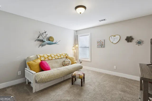 a bathroom with a sink a toilet and shower curtain