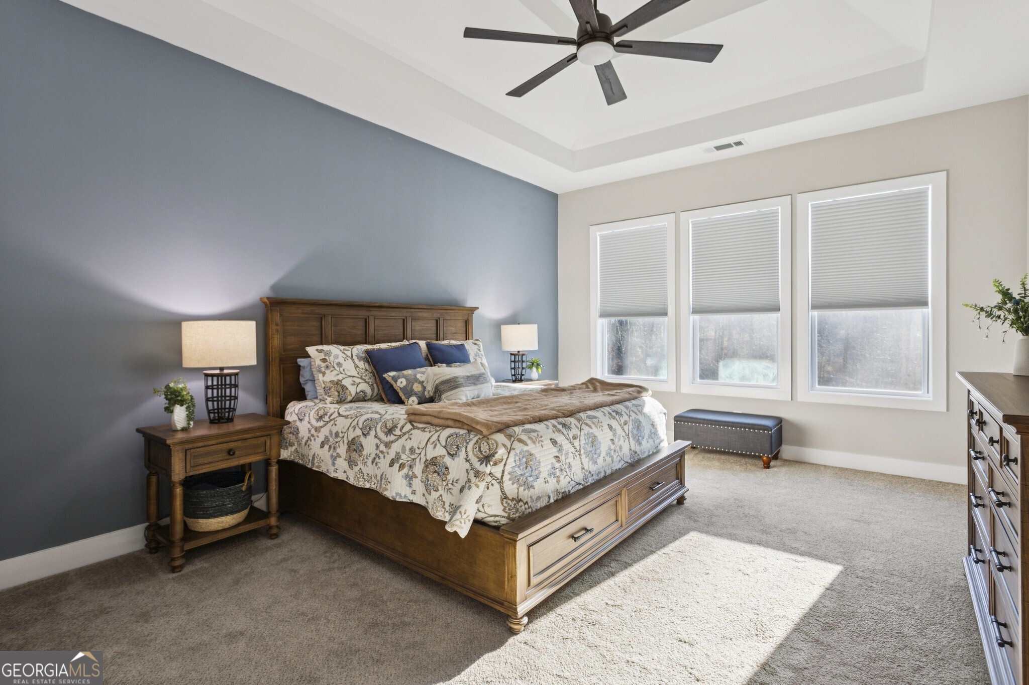 20 Bluestone Way Northeast Cartersville, GA 30121 - Photo 4 of 55 The Main-Level Primary Suite is a true retreat, featuring Tall Ceilings and a Spa-Like Ensuite Bathroom with a Glass Shower, Dual Stone Vanity, and a Large Walk-In Closet.