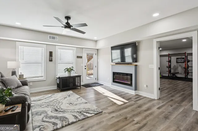a living room with furniture window and fireplace