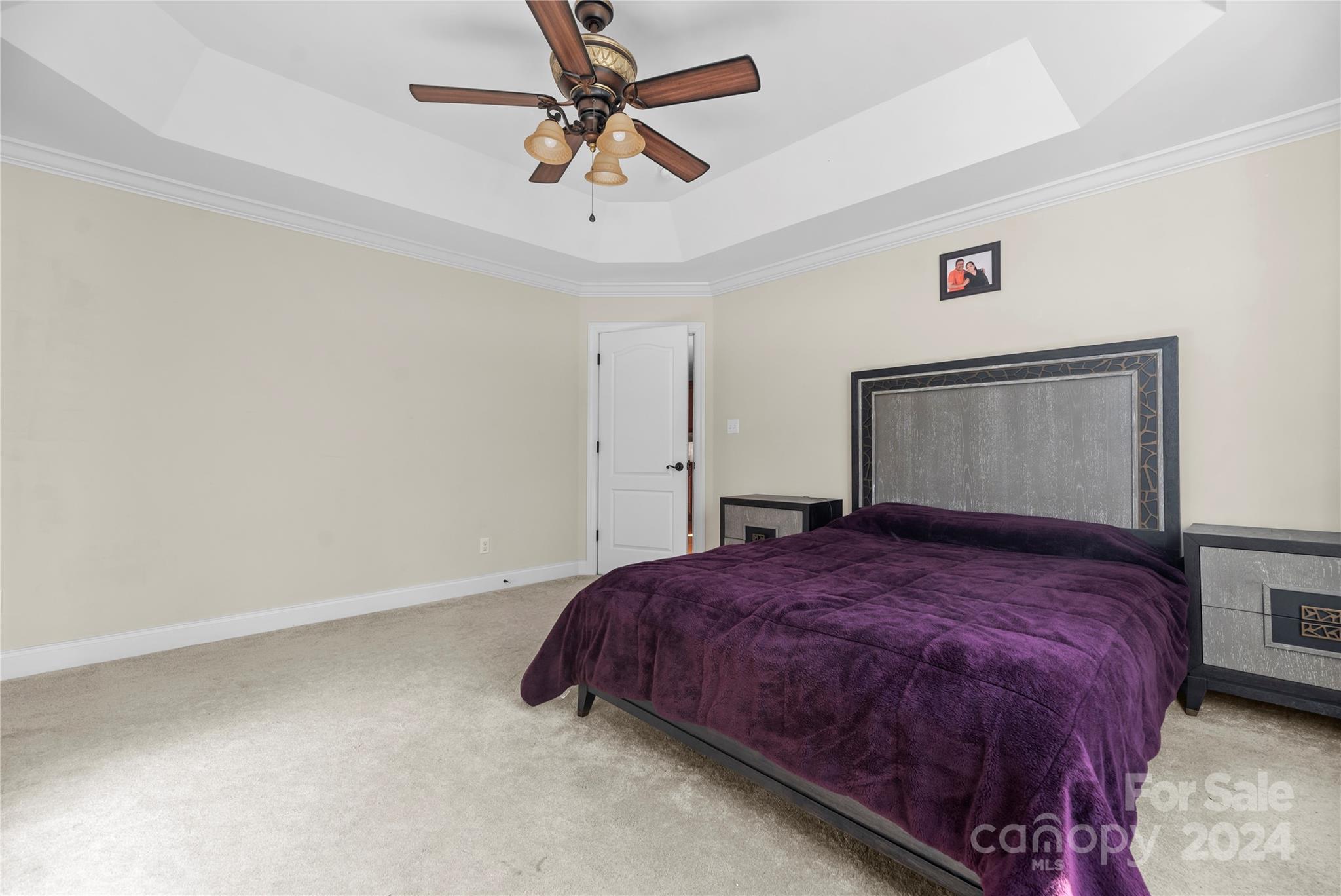 1350 Kensington Circle Newton, NC 28658 - Photo 12 of 45 a bedroom with a bed and a ceiling fan