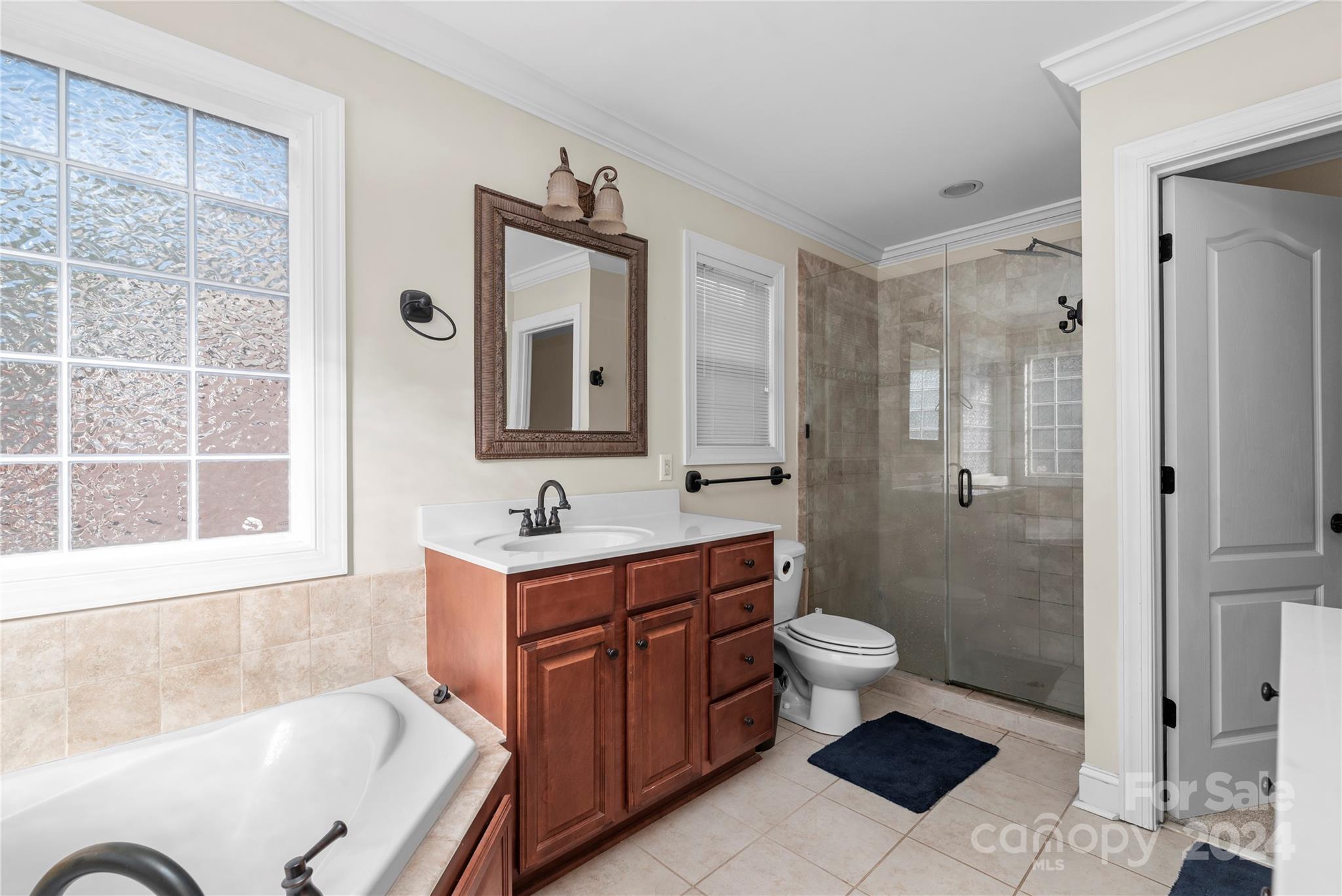 1350 Kensington Circle Newton, NC 28658 - Photo 15 of 45 a bathroom with a toilet sink and mirror