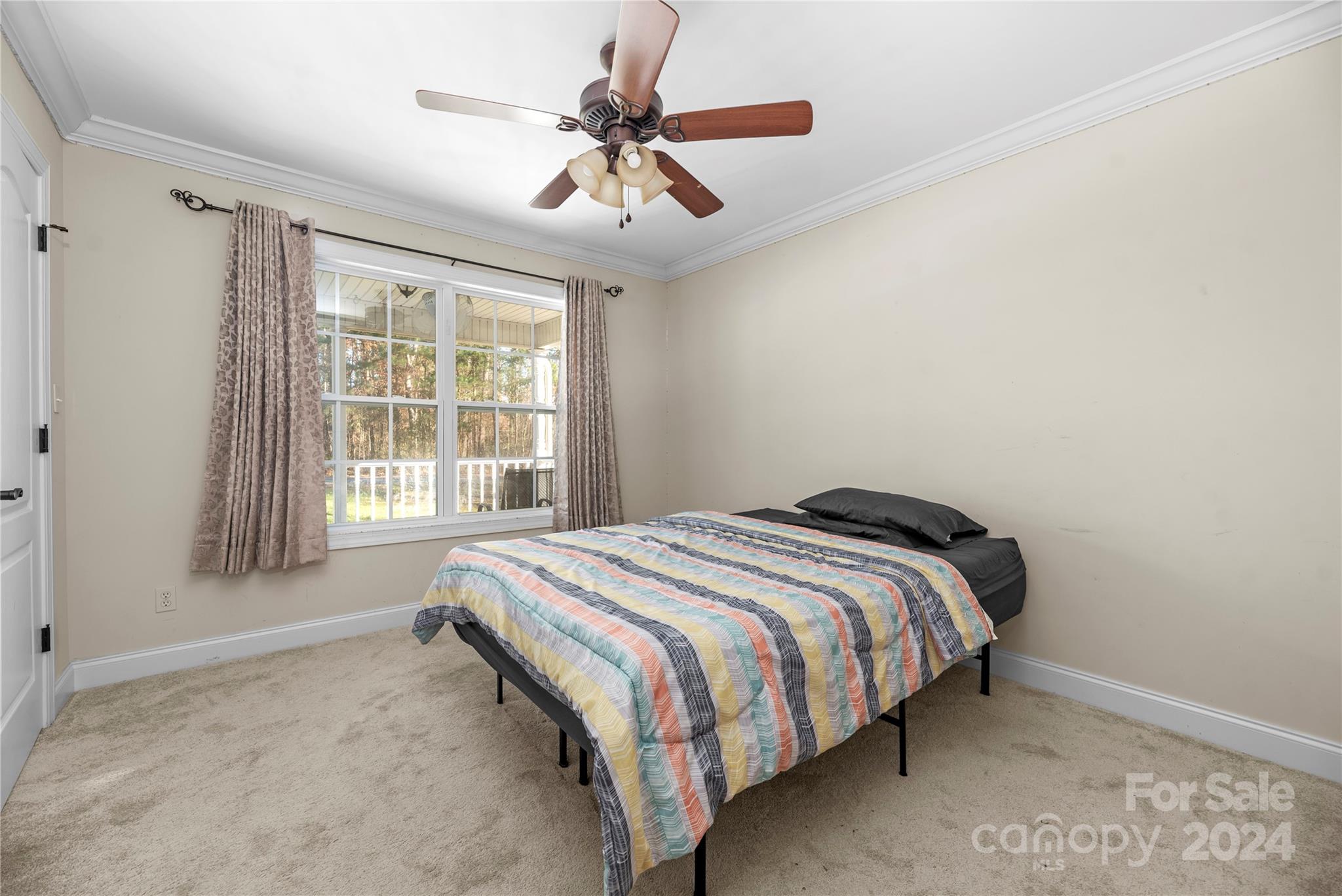 1350 Kensington Circle Newton, NC 28658 - Photo 16 of 45 a bedroom with a bed and a window