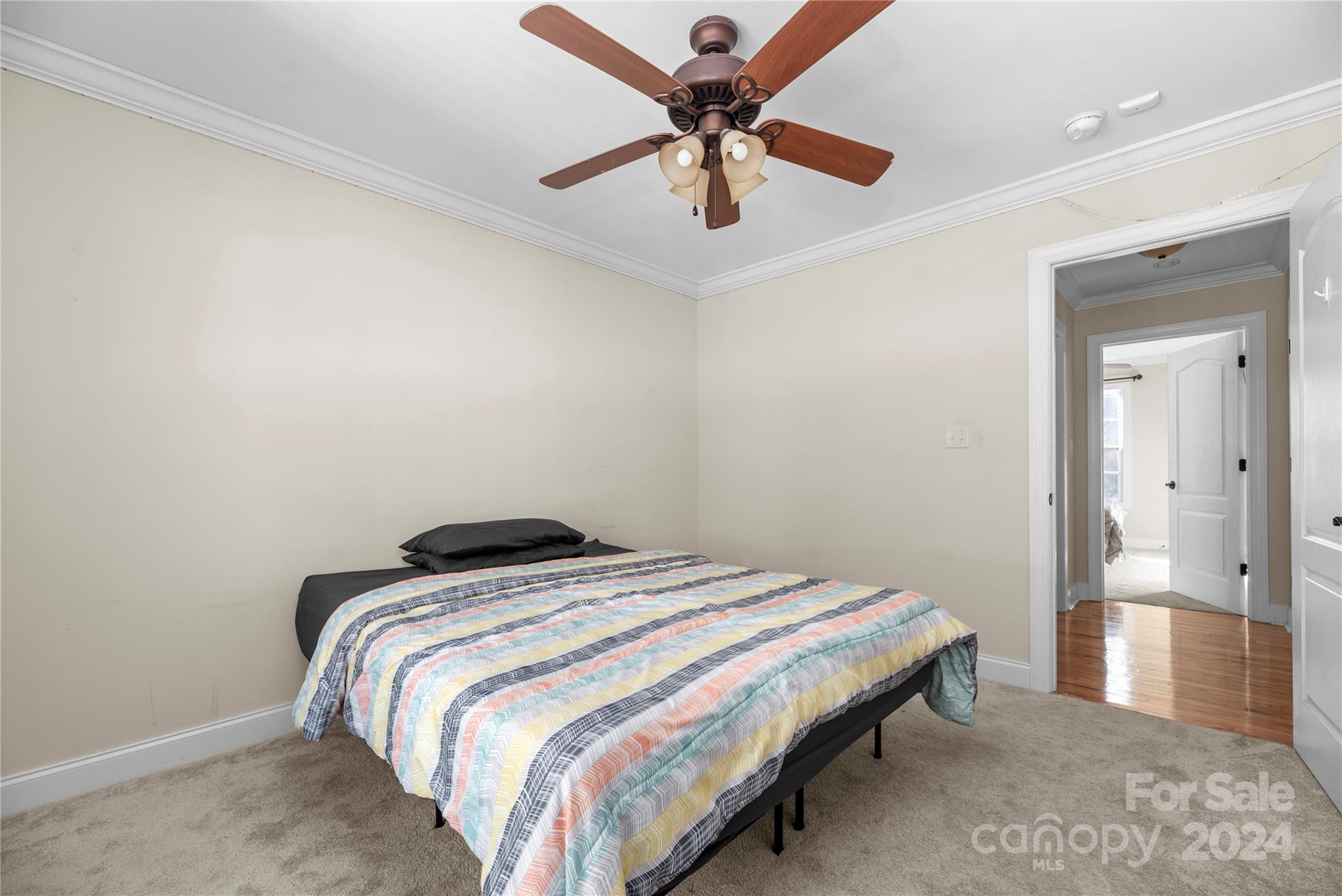 1350 Kensington Circle Newton, NC 28658 - Photo 17 of 45 a bedroom with a bed and a ceiling fan