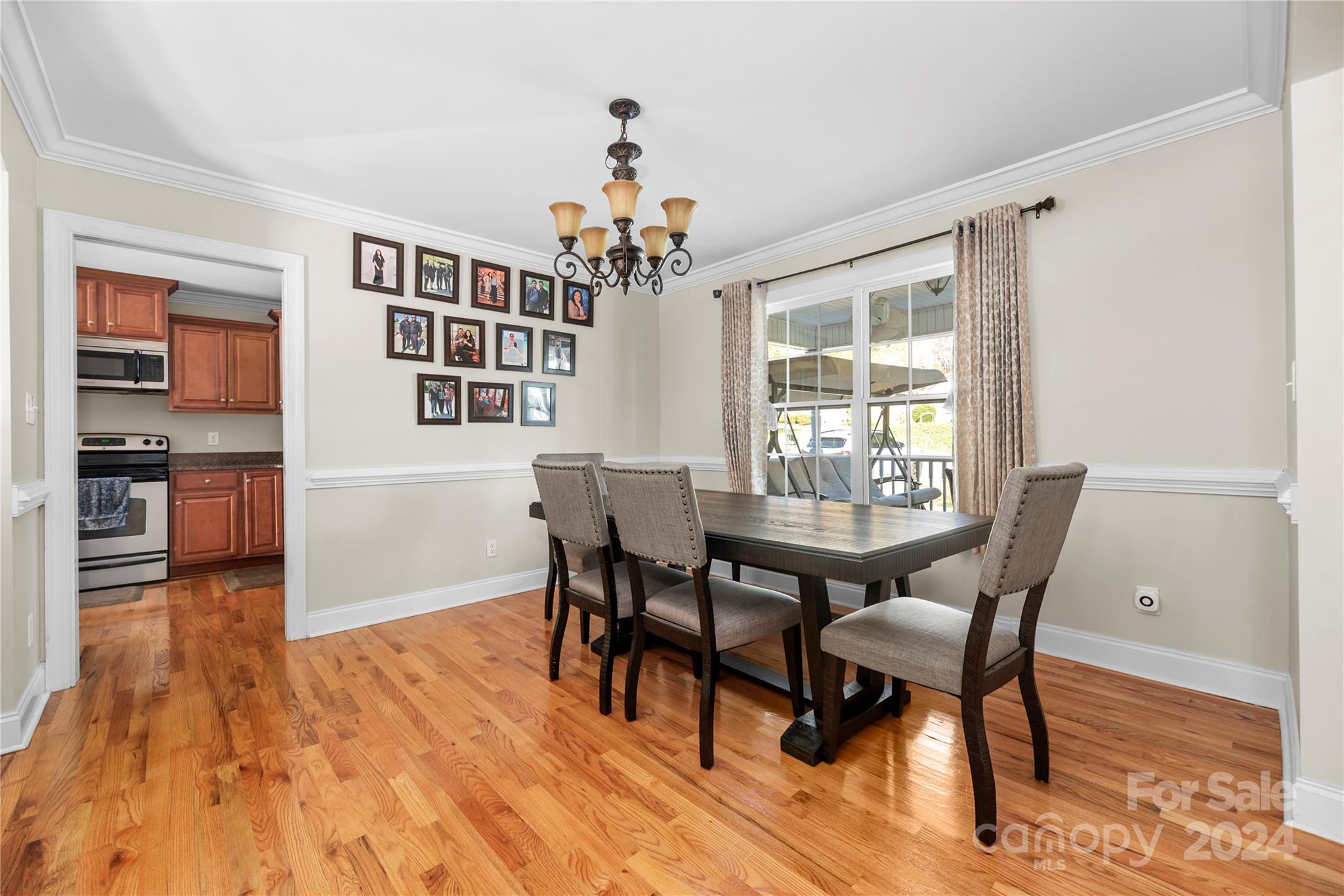1350 Kensington Circle Newton, NC 28658 - Photo 21 of 45 a view of a dining room with furniture window and wooden floor