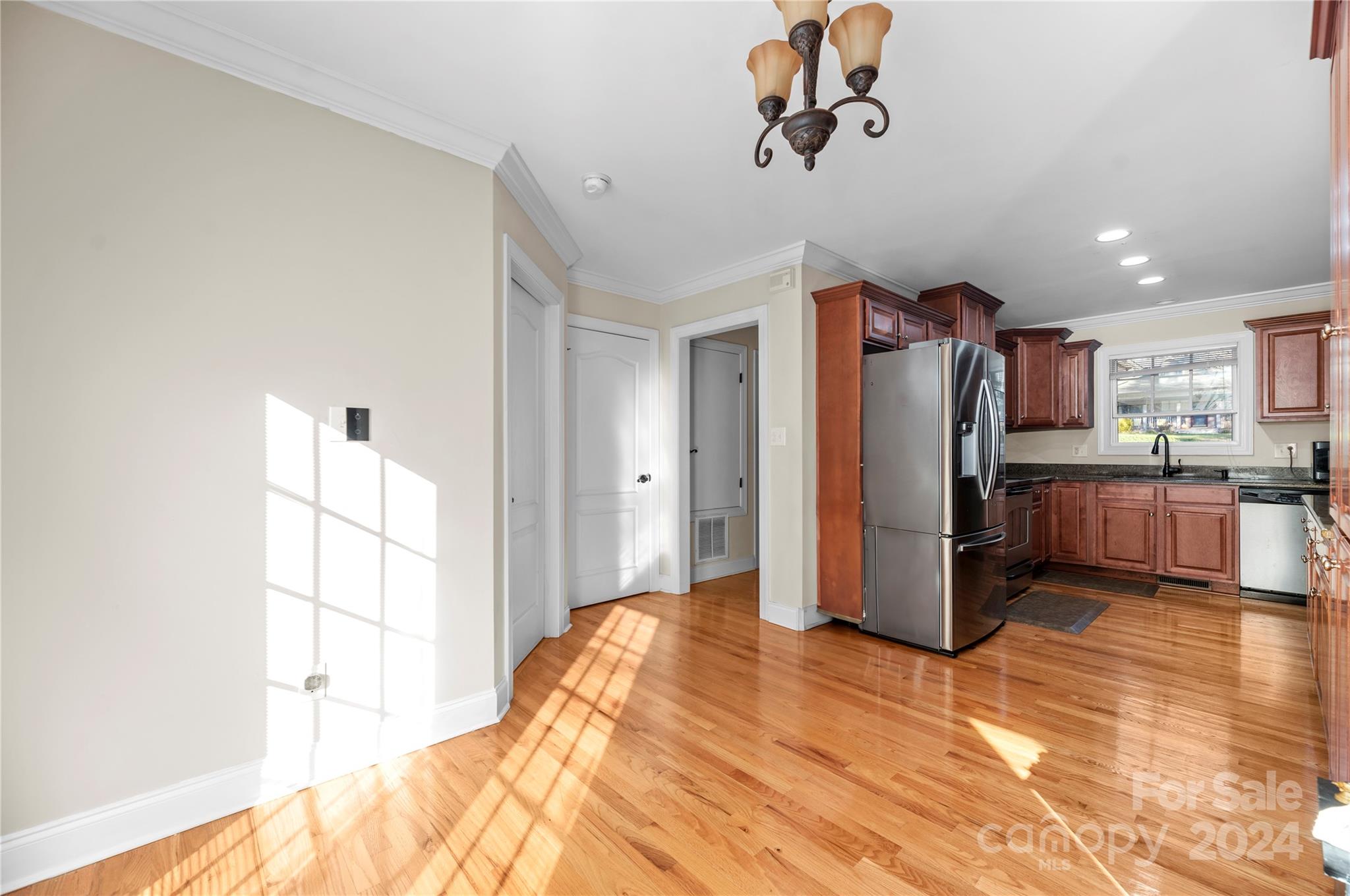 1350 Kensington Circle Newton, NC 28658 - Photo 9 of 45 a view of a kitchen with a refrigerator a microwave and a sink