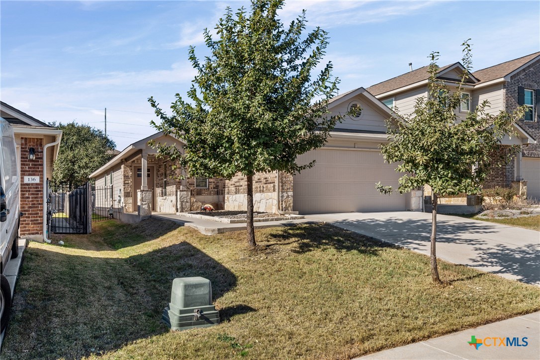 132 Dunlin Lane Leander, TX 78641 - Photo 1 of 1 a front view of a house with garden