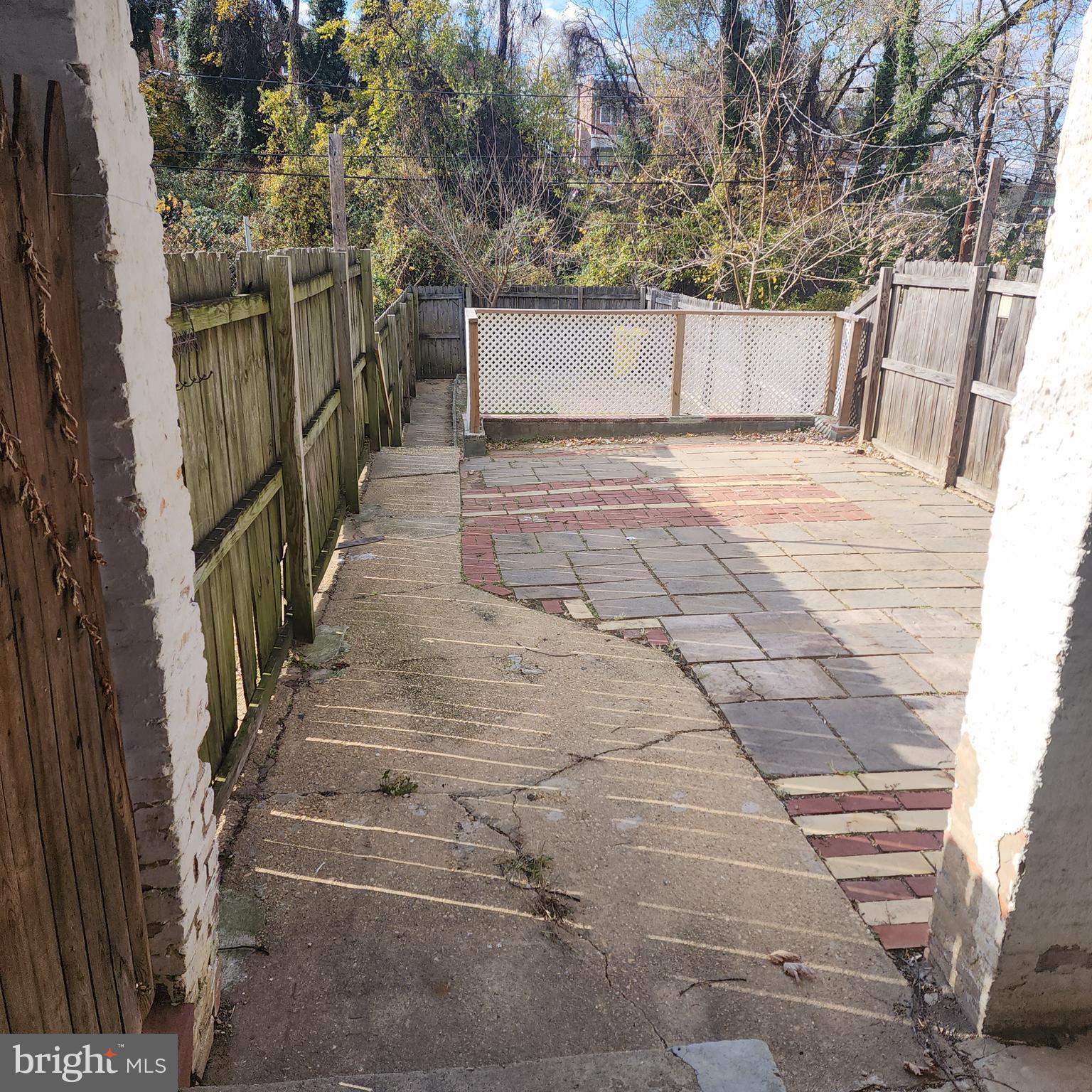 327 Grove Park Road Brooklyn, MD 21225 - Photo 11 of 20 a view of a pathway with a white house