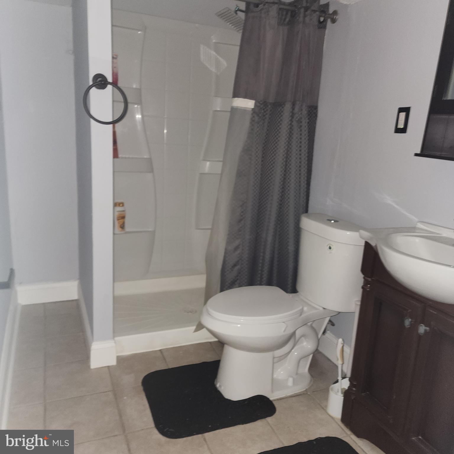 327 Grove Park Road Brooklyn, MD 21225 - Photo 18 of 20 a bathroom with a toilet and a shower