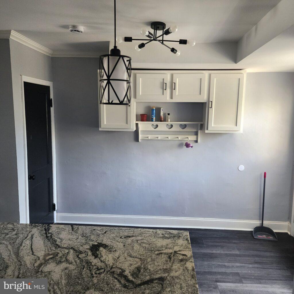 327 Grove Park Road Brooklyn, MD 21225 - Photo 7 of 20 a view of kitchen with furniture and wooden floor