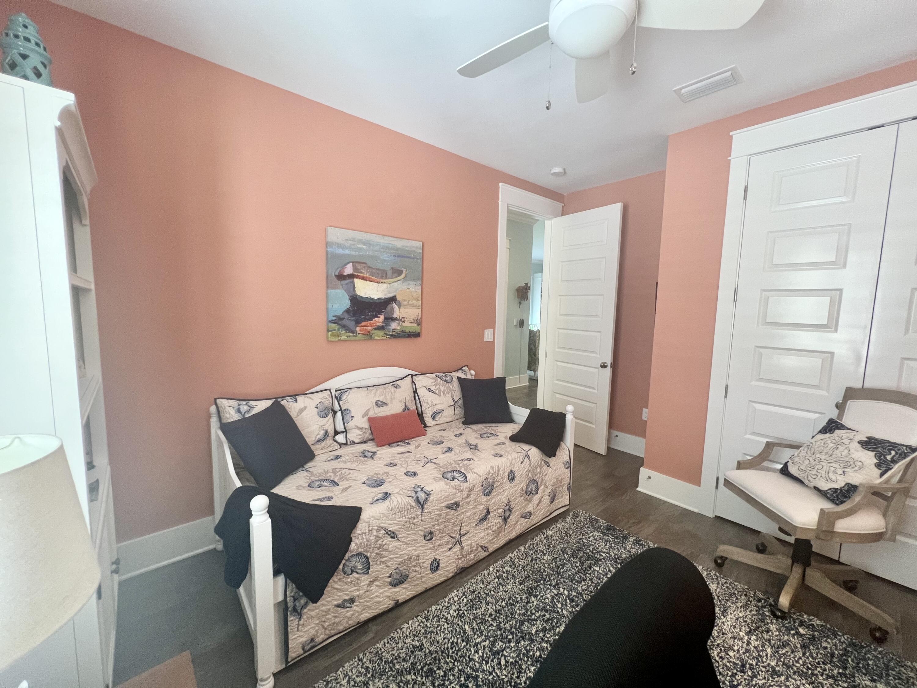 244 Perimeter Place Freeport, FL 32439 - Photo 15 of 72 a bedroom with a bed and wooden floor