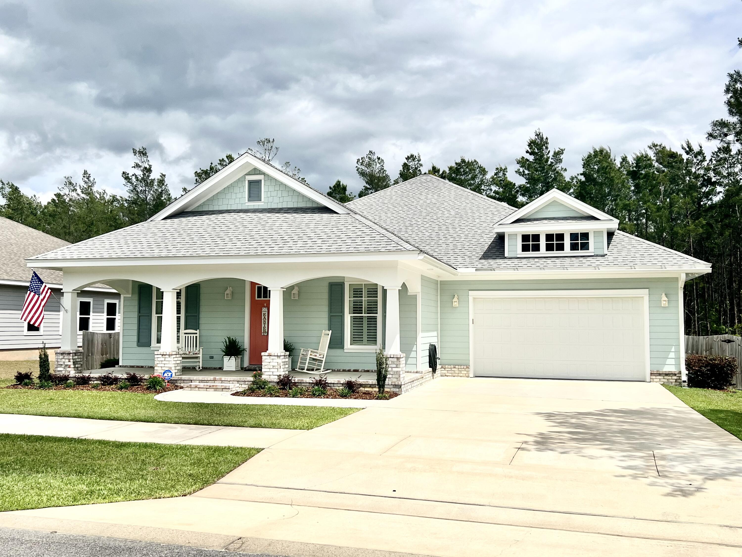 244 Perimeter Place Freeport, FL 32439 - Photo 2 of 72 a front view of a house with a yard