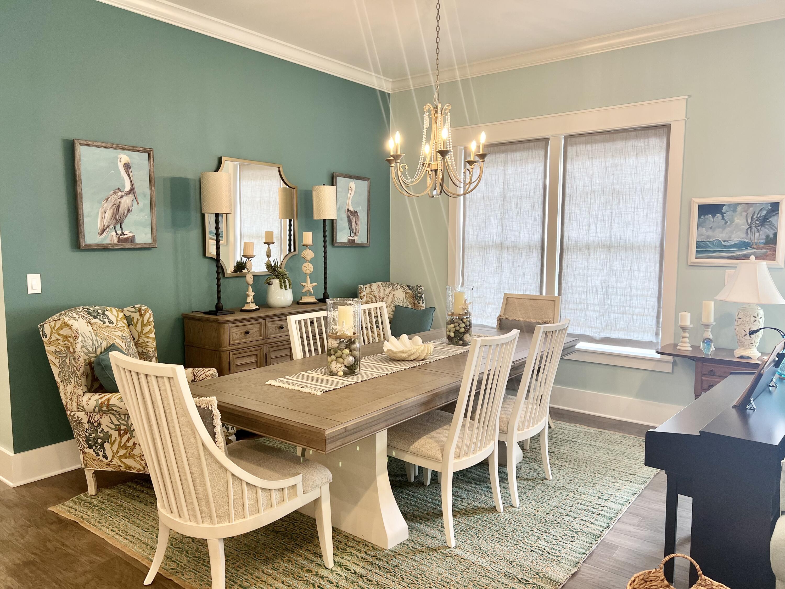 244 Perimeter Place Freeport, FL 32439 - Photo 21 of 72 a view of a dining room with furniture a chandelier and wooden floor