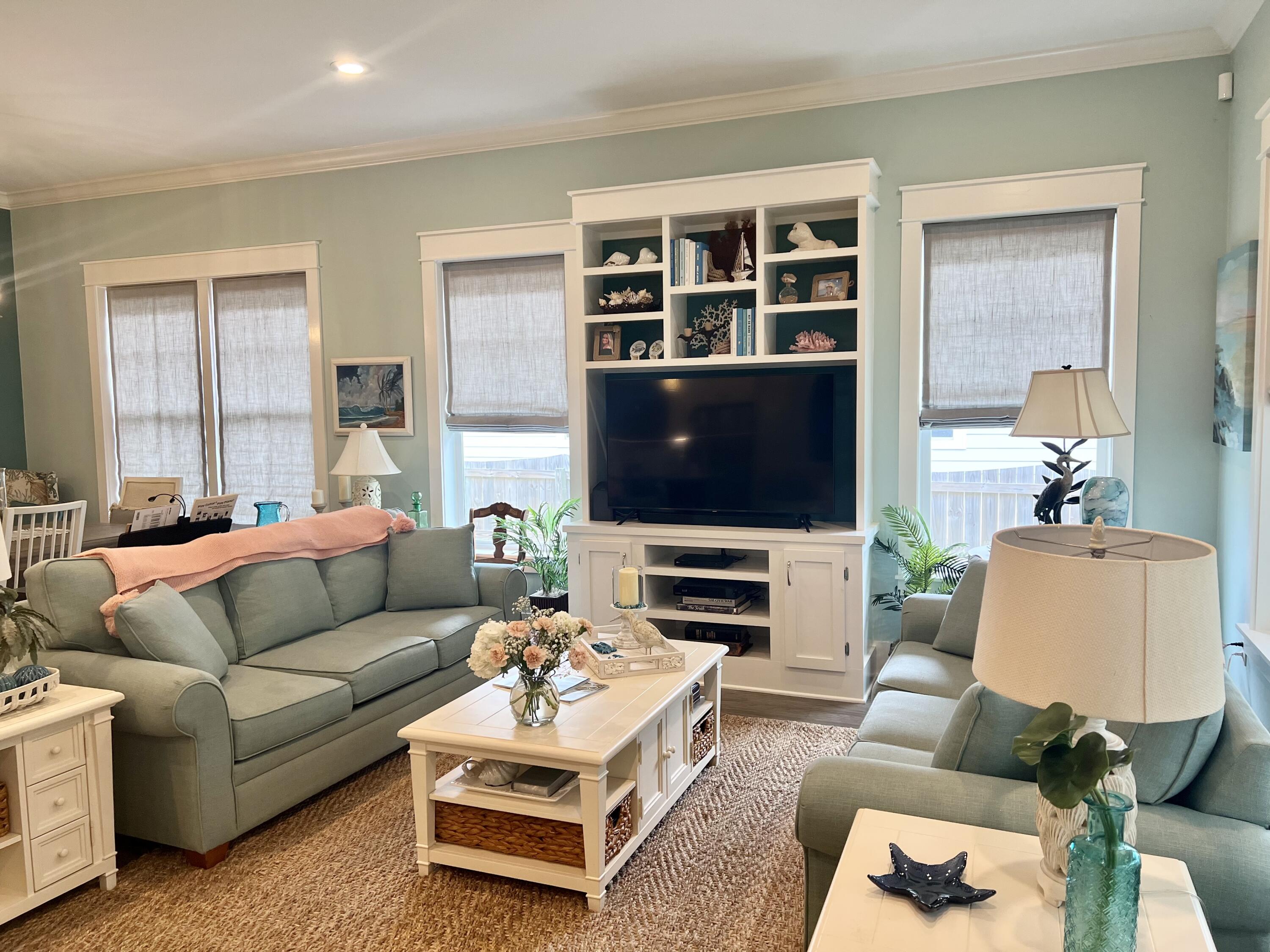 244 Perimeter Place Freeport, FL 32439 - Photo 24 of 72 a living room with furniture and a flat screen tv