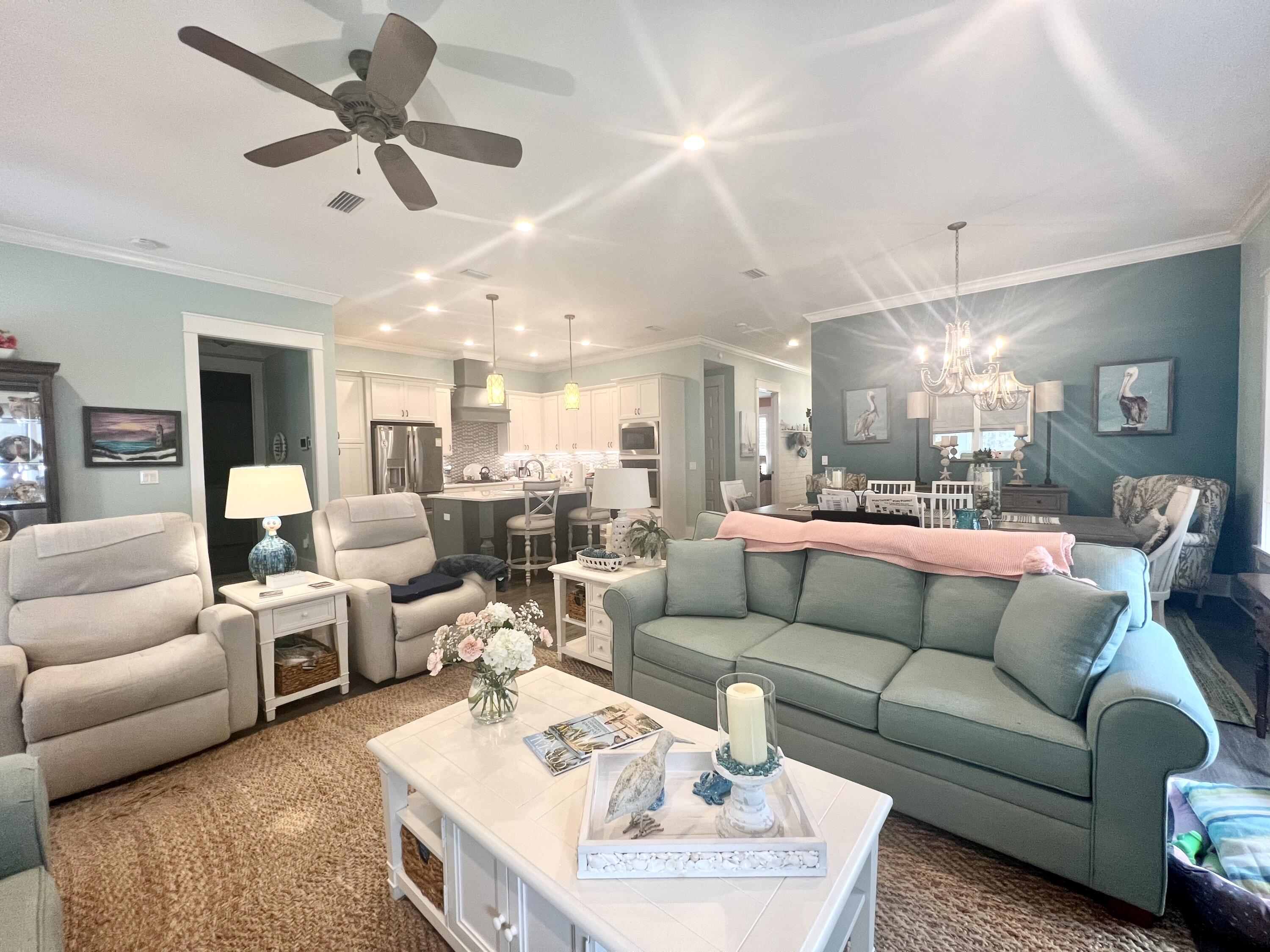 244 Perimeter Place Freeport, FL 32439 - Photo 26 of 72 a living room with furniture kitchen view and a chandelier