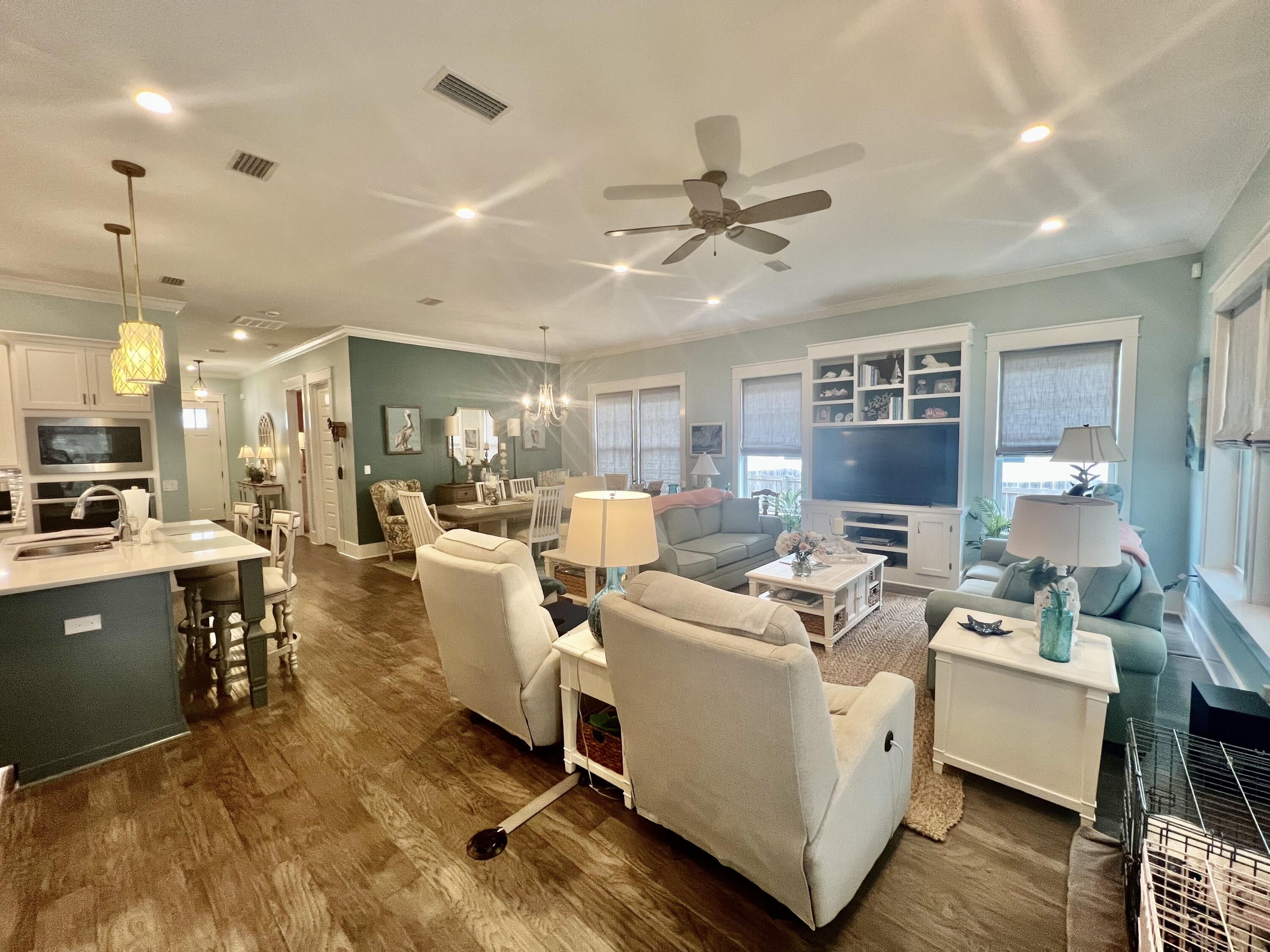 244 Perimeter Place Freeport, FL 32439 - Photo 28 of 72 a living room with furniture kitchen view and a chandelier