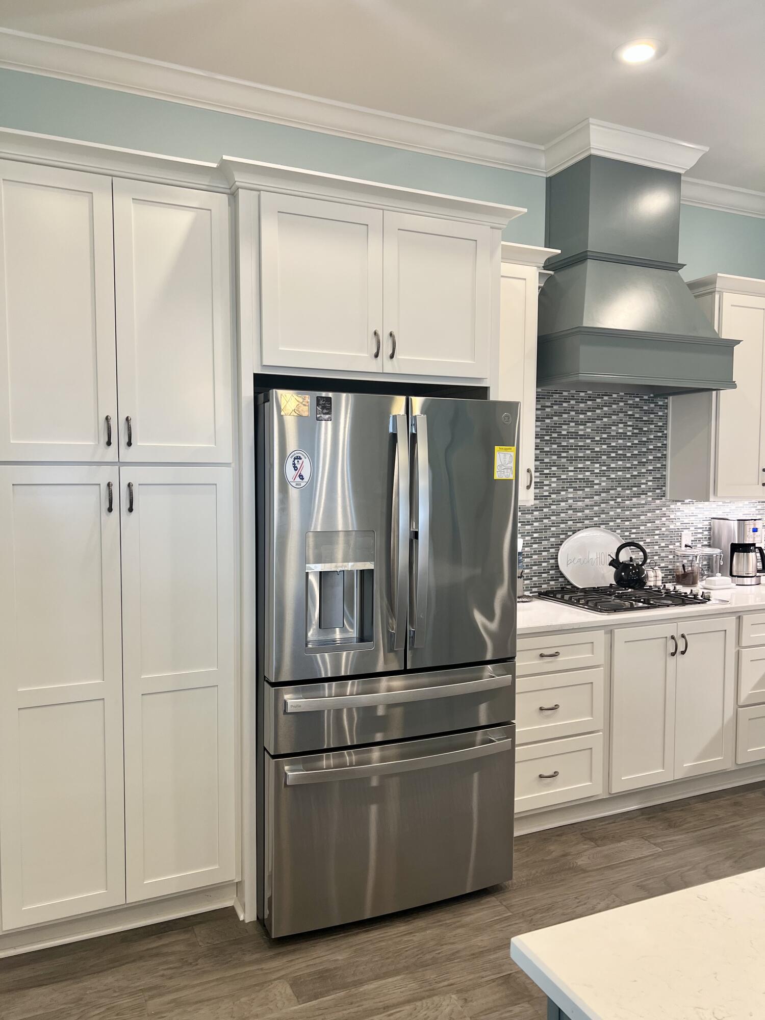 244 Perimeter Place Freeport, FL 32439 - Photo 36 of 72 a kitchen with stainless steel appliances granite countertop a refrigerator and a sink