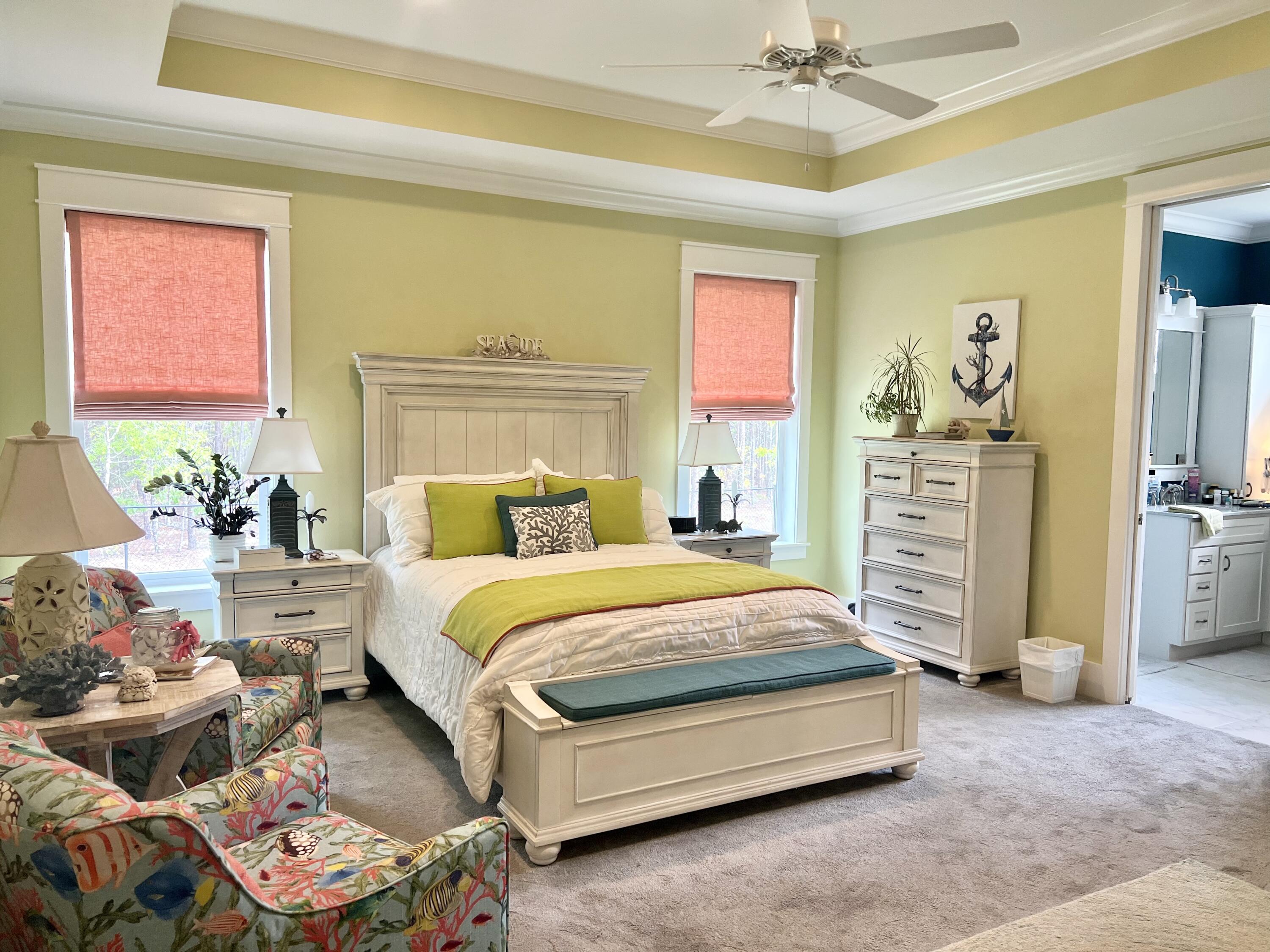 244 Perimeter Place Freeport, FL 32439 - Photo 45 of 72 a bedroom with a bed and a chandelier