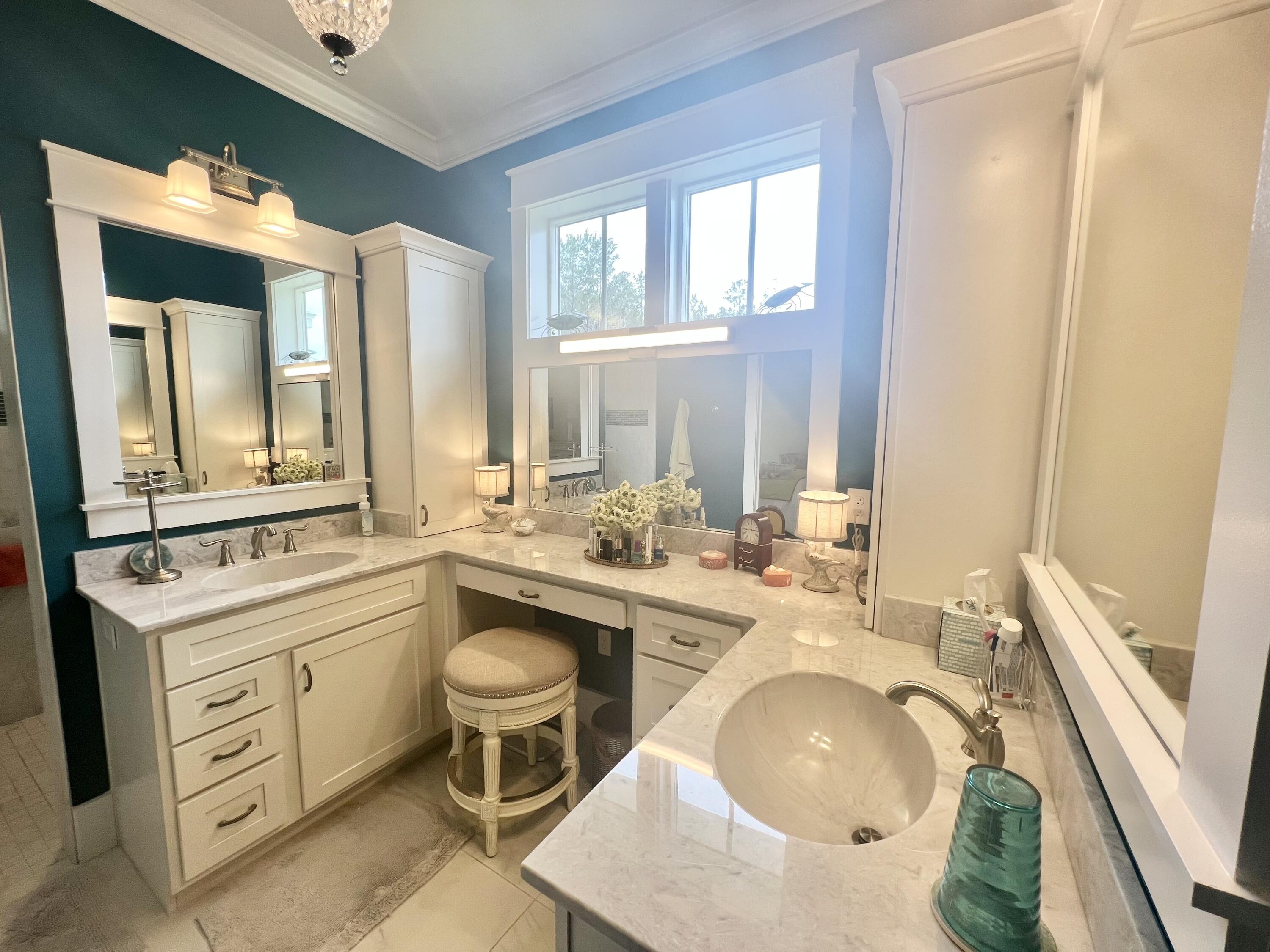 244 Perimeter Place Freeport, FL 32439 - Photo 52 of 72 a bathroom with a granite countertop sink mirror and a bathtub