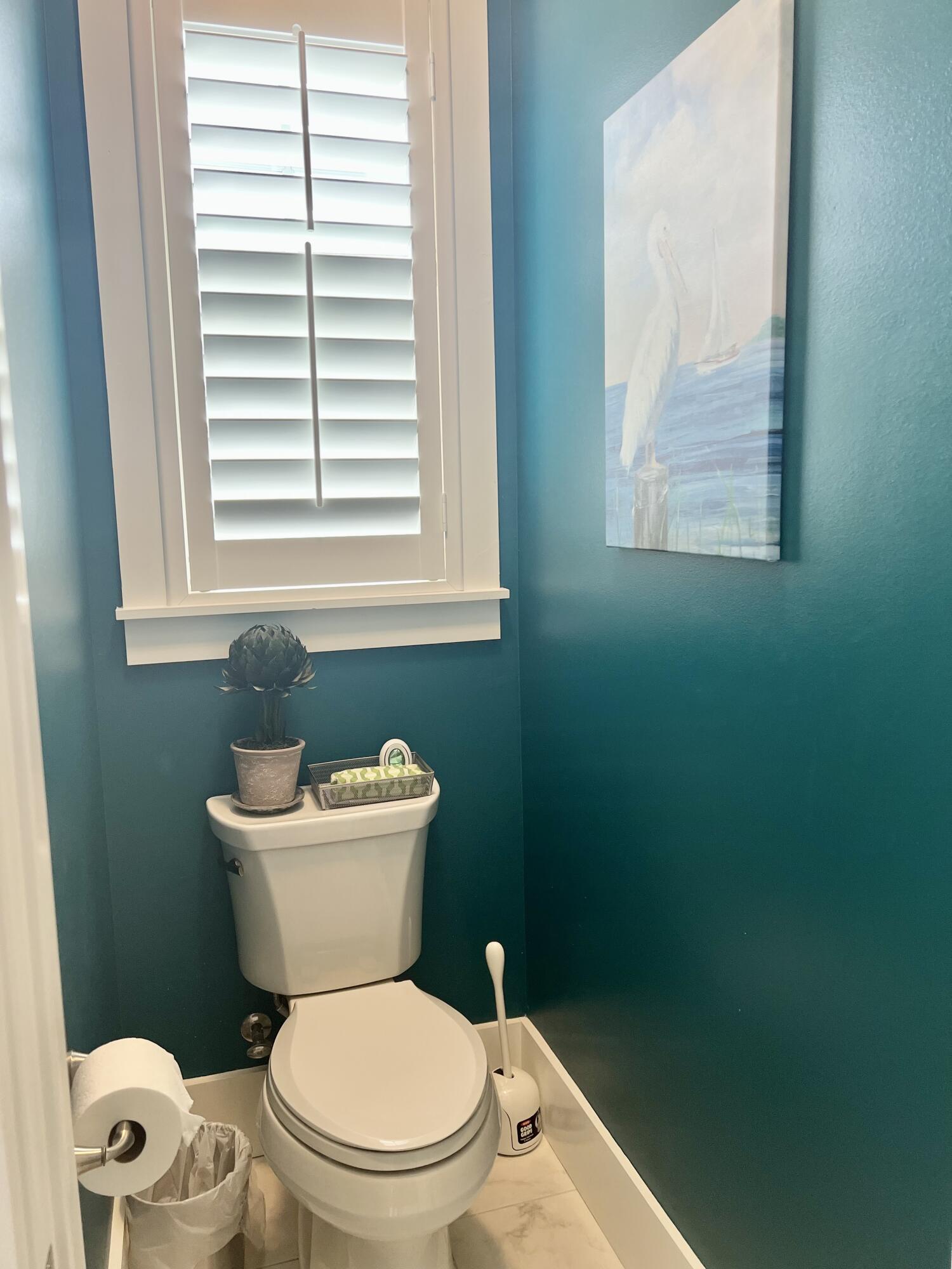 244 Perimeter Place Freeport, FL 32439 - Photo 55 of 72 a white toilet sitting next to a bathroom sink