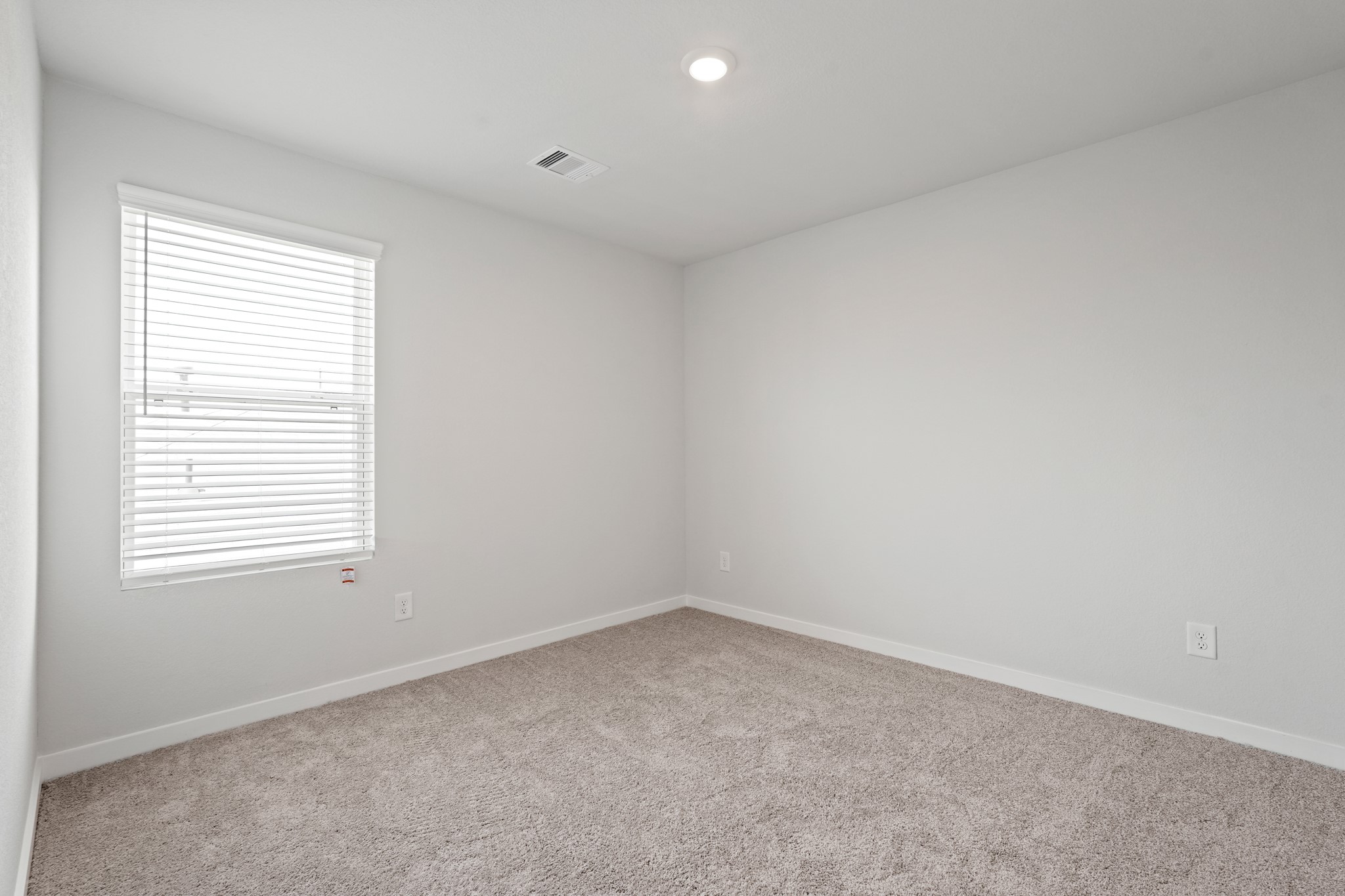 136 Rising Cedar Lane Hockley, TX 77447 - Photo 15 of 22 an empty room with a window