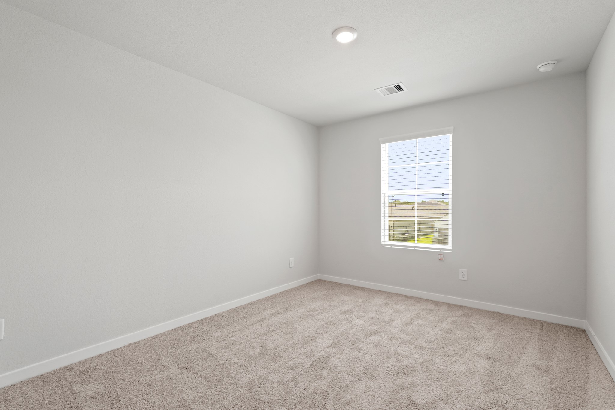 136 Rising Cedar Lane Hockley, TX 77447 - Photo 18 of 22 an empty room with windows