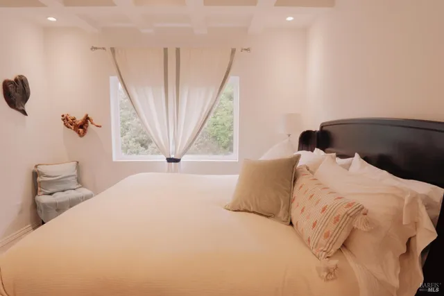 a bathroom with a sink vanity granite and a mirror