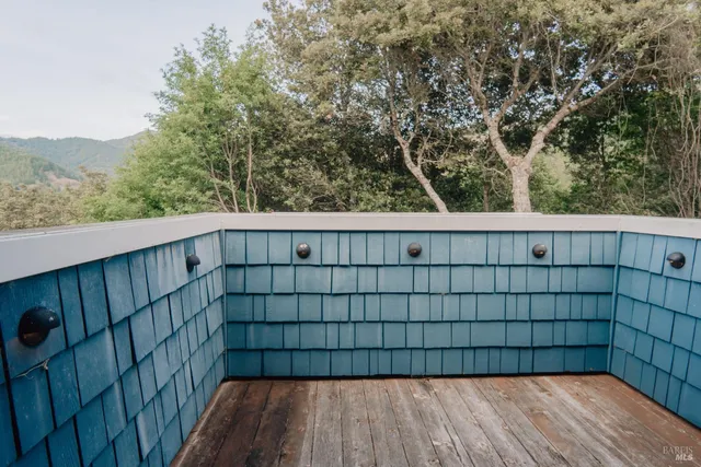 an aerial view of a house with outdoor space and sitting area