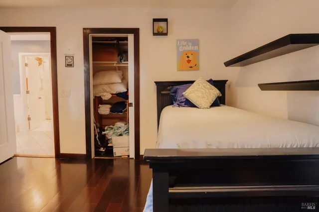 a large white bed in a white room