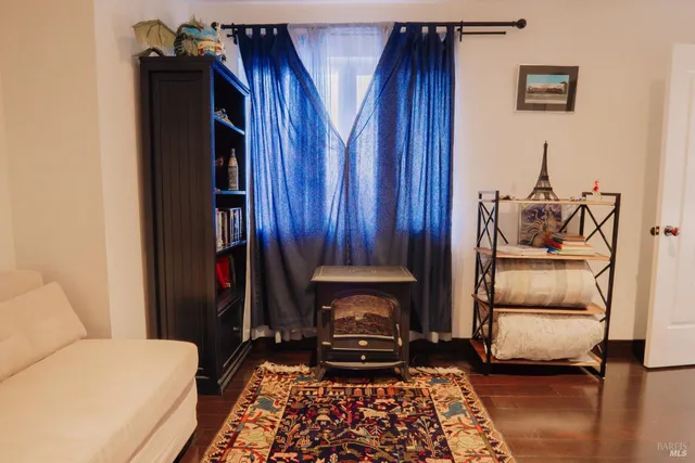 a bedroom with furniture and a window