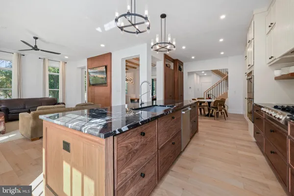 a dining room with furniture and wooden floor